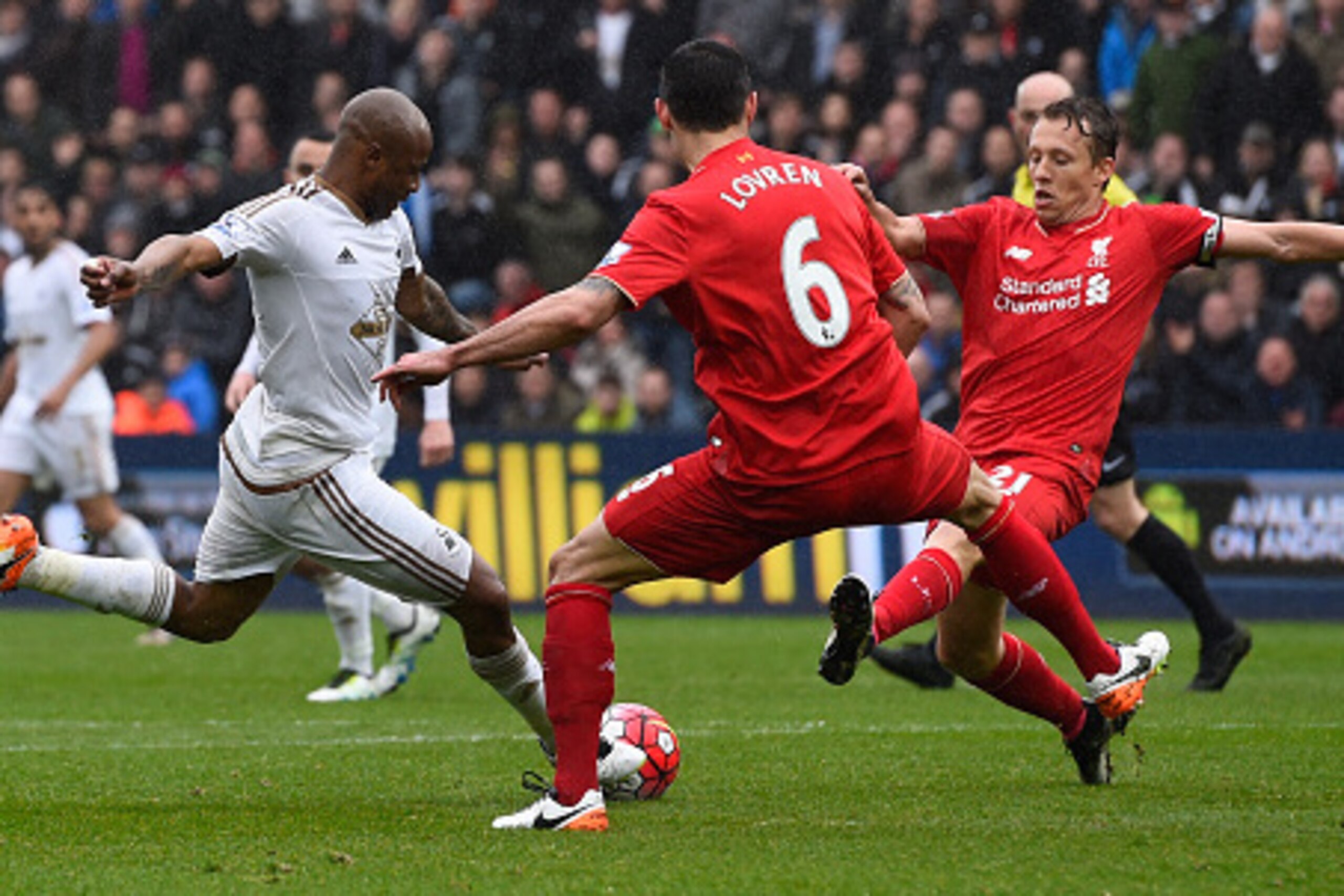 Andre Ayew turns to fire in his second goal of the game at the Liberty Stadium on Sunday.