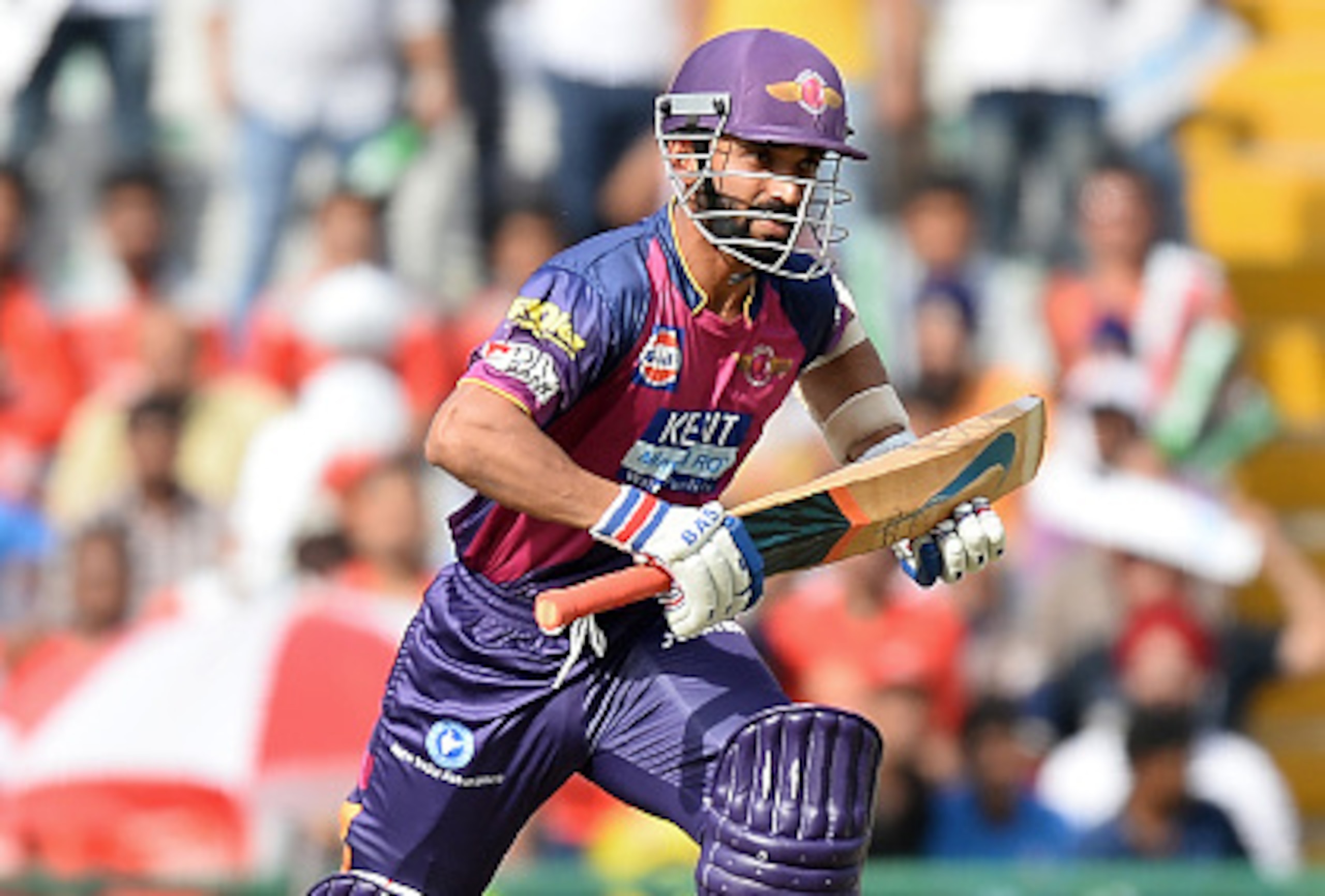 Rising Pune Supergiants batsman Ajinkya Rahane runs between the wickets during the 2016 Indian Premier League (IPL) Twenty20 cricket match between Rising Pune Supergiants and Kings XI Punjab at The Punjab Cricket Association Stadium in Mohali on April 17,