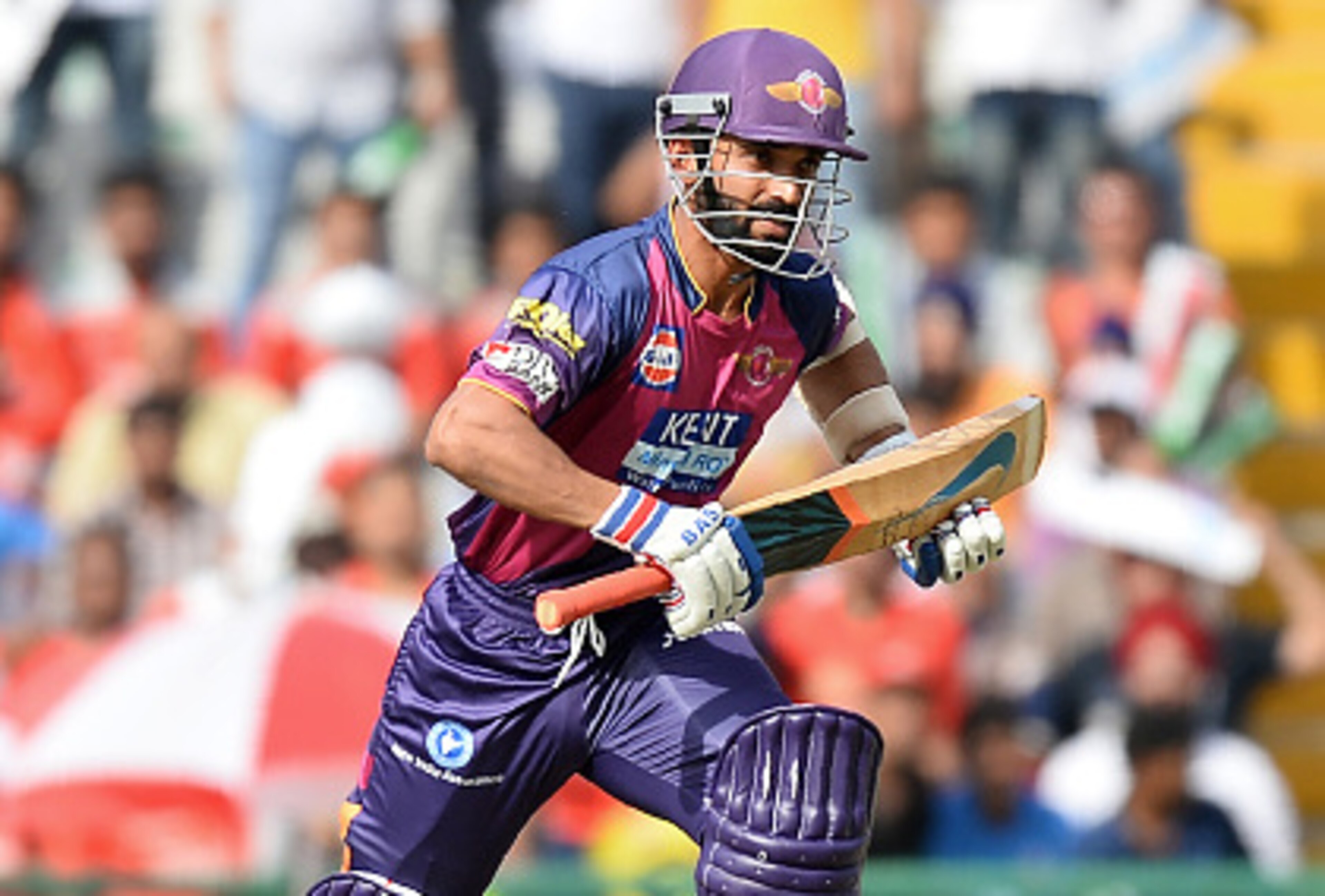 Rising Pune Supergiants batsman Ajinkya Rahane runs between the wickets during the 2016 Indian Premier League (IPL) Twenty20 cricket match between Rising Pune Supergiants and Kings XI Punjab at The Punjab Cricket Association Stadium in Mohali on April 17,