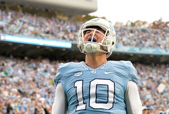 CHAPEL HILL, NC - NOVEMBER 07:  Mitch Trubisky #10 of the North Carolina Tar Heels reacts after scoring a touchdown against the Duke Blue Devils during their game at Kenan Stadium on November 7, 2015 in Chapel Hill, North Carolina. North Carolina won 66-3
