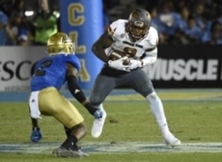 Oct 3, 2015; Pasadena, CA, USA; Arizona State Sun Devils running back Kalen Ballage (9) runs against UCLA Bruins defensive back Jaleel Wadood (2) during the game at Rose Bowl. Mandatory Credit: Richard Mackson-USA TODAY Sports