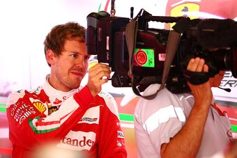 Sebastian Vettel checks out a television camera at the Chinese Grand Prix.
