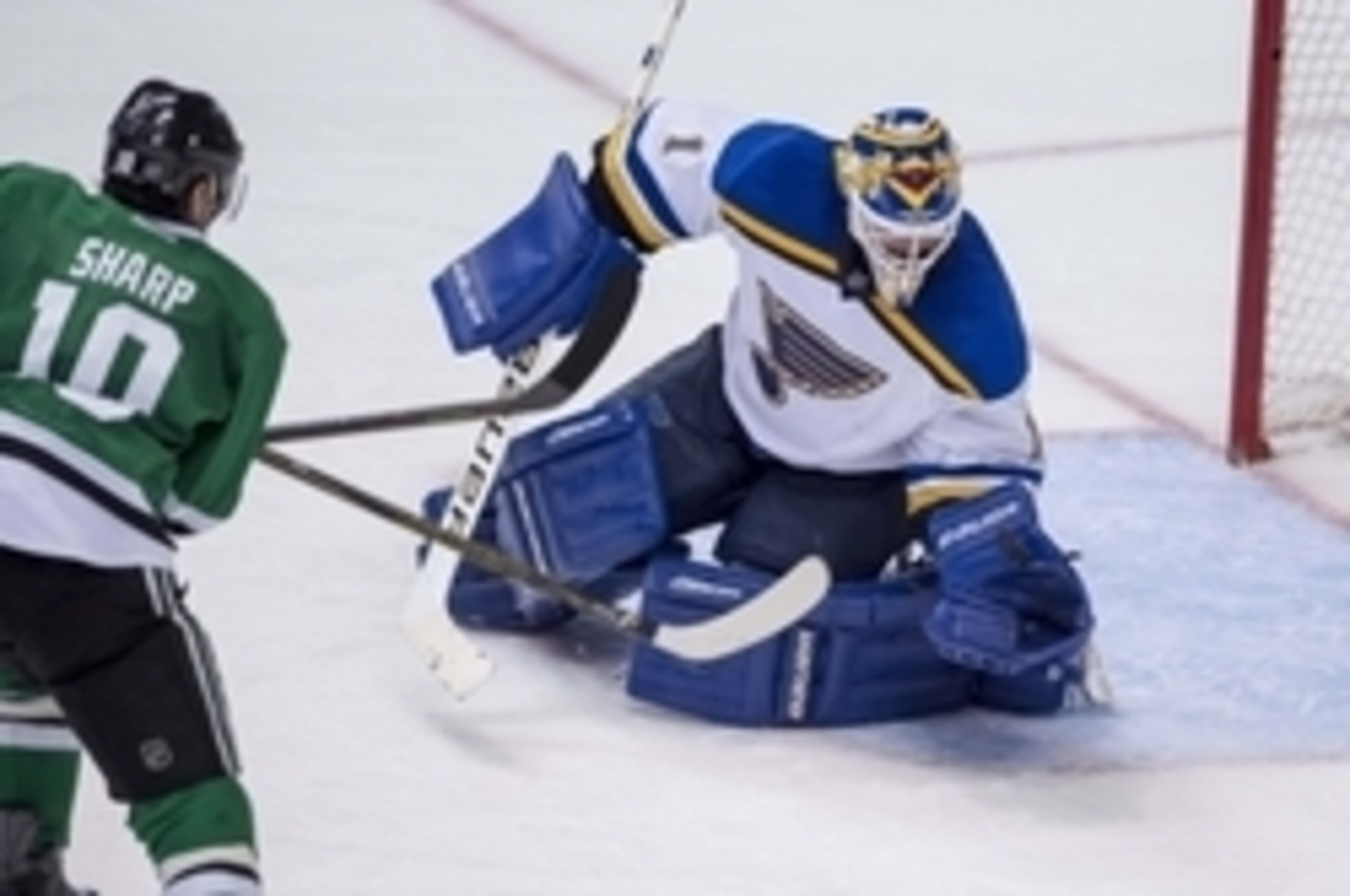 May 11, 2016; Dallas, TX, USA; St. Louis Blues goalie Brian Elliott (1) makes a save against Dallas Stars left wing Patrick Sharp (10) during the third period in game seven of the second round of the 2016 Stanley Cup Playoffs at American Airlines Center. 