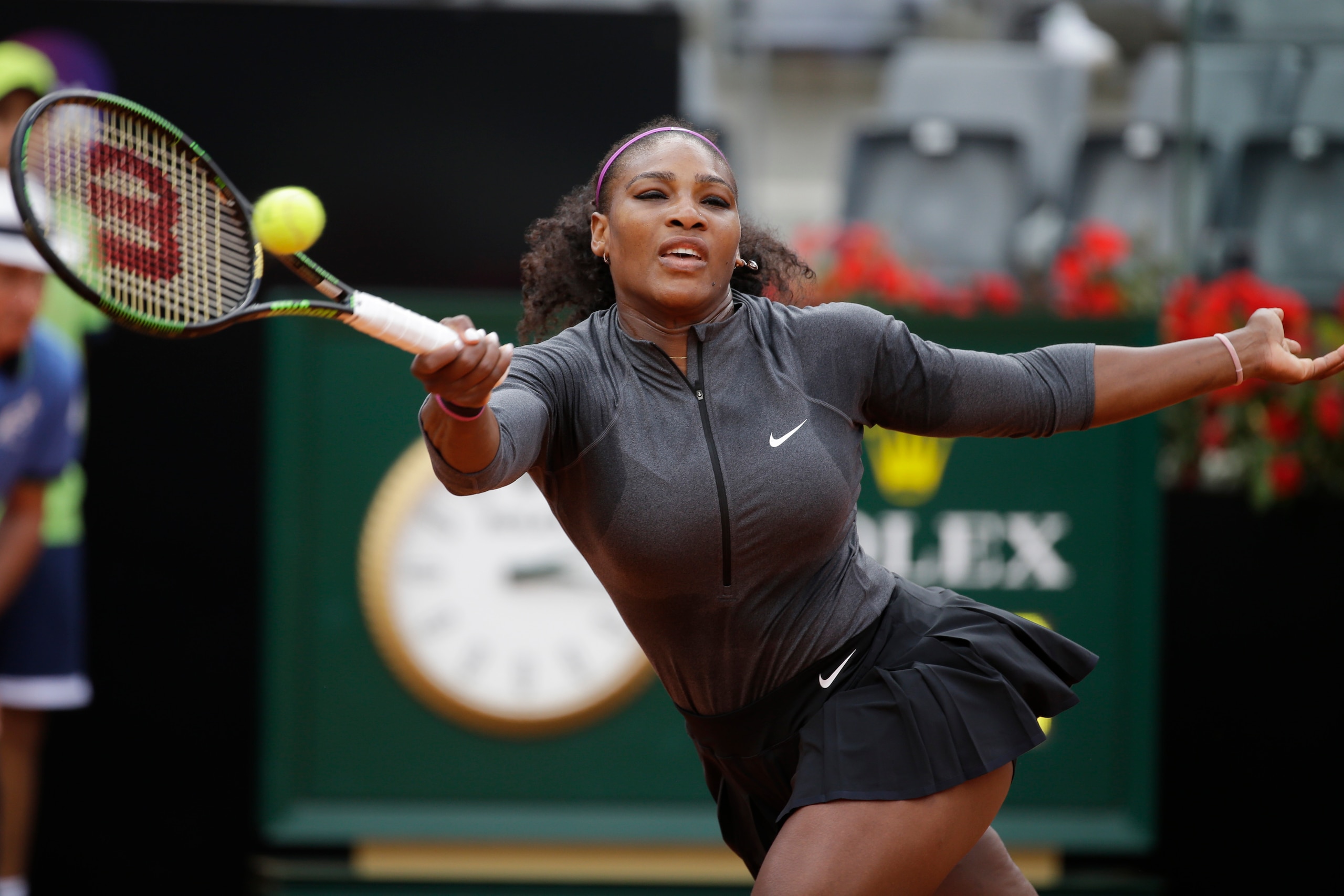 Serena Williams hits a running forehand during a match at the 2016 Rome Open.