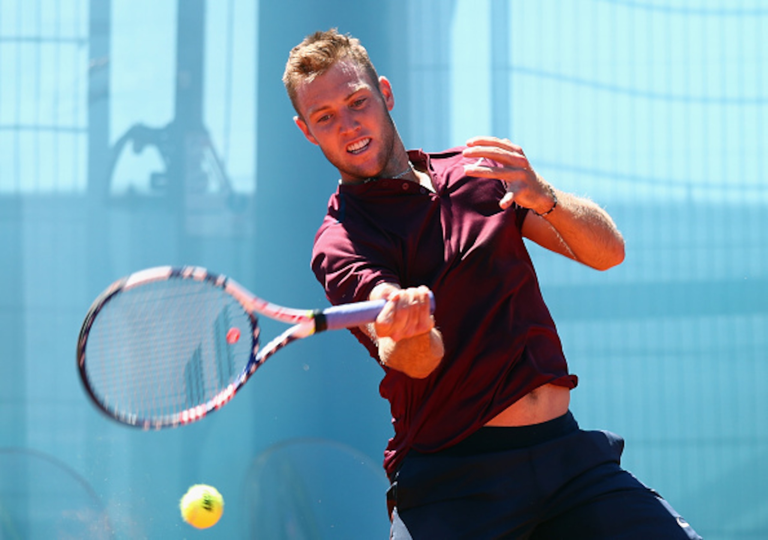 Jack Sock hits a forehand during the 2016 Madrid Open.