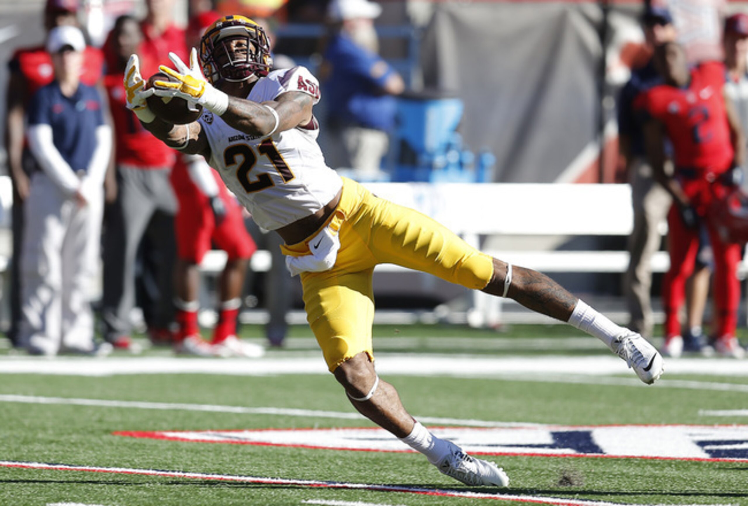A college football wide receiver shouldn't be punished for making a diving catch. A college football wide receiver shouldn't be punished for making a diving catch.