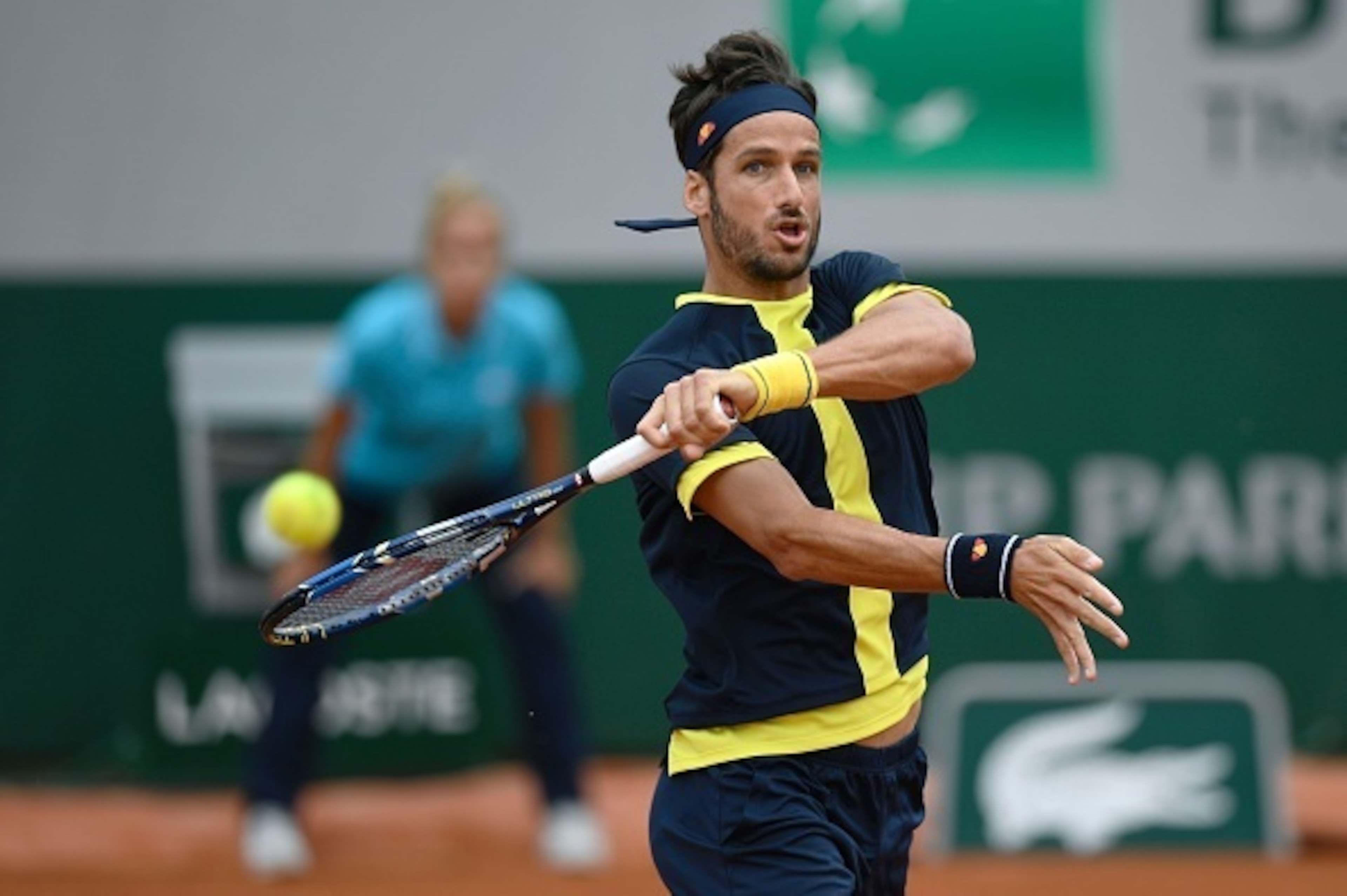 Feliciano Lopez whips a forehand during a match at the 2016 French Open.