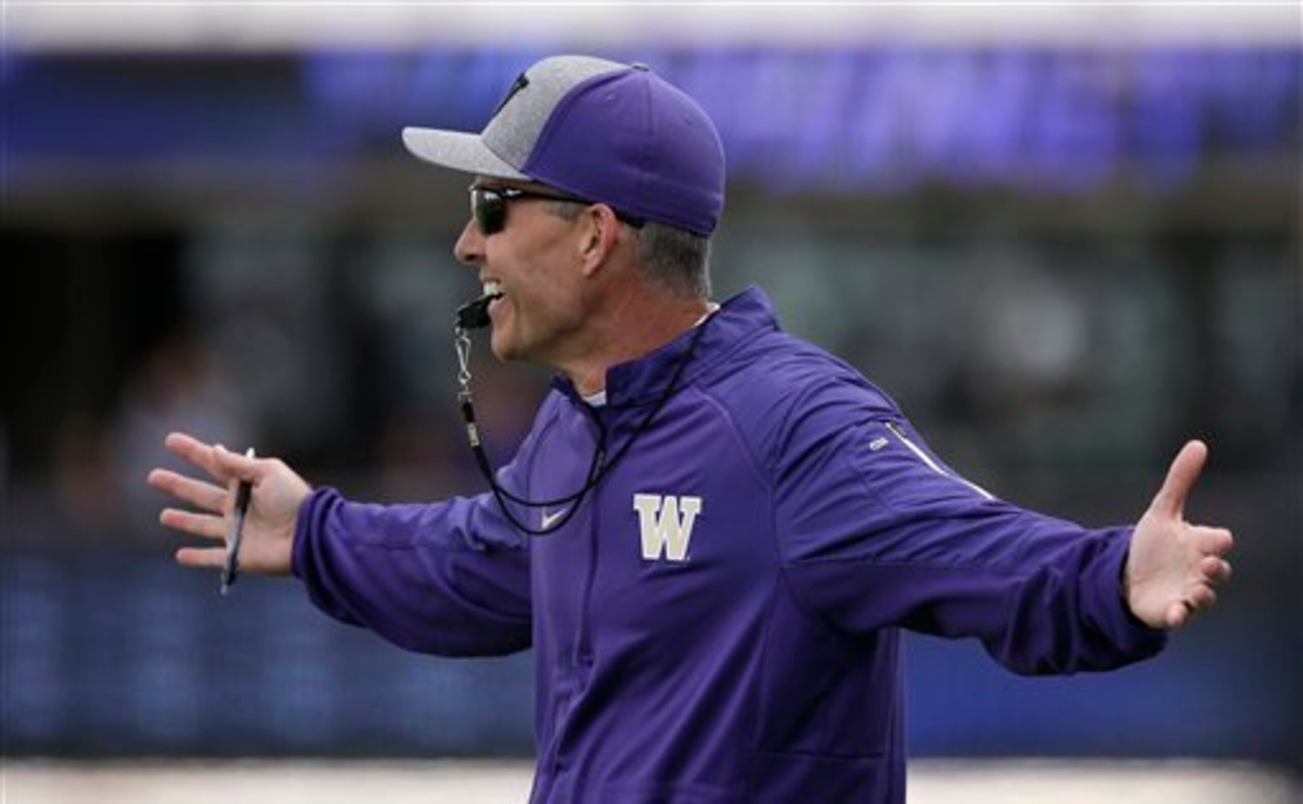 Chris Petersen hopes to control the hype surrounding his Washington program this summer.
