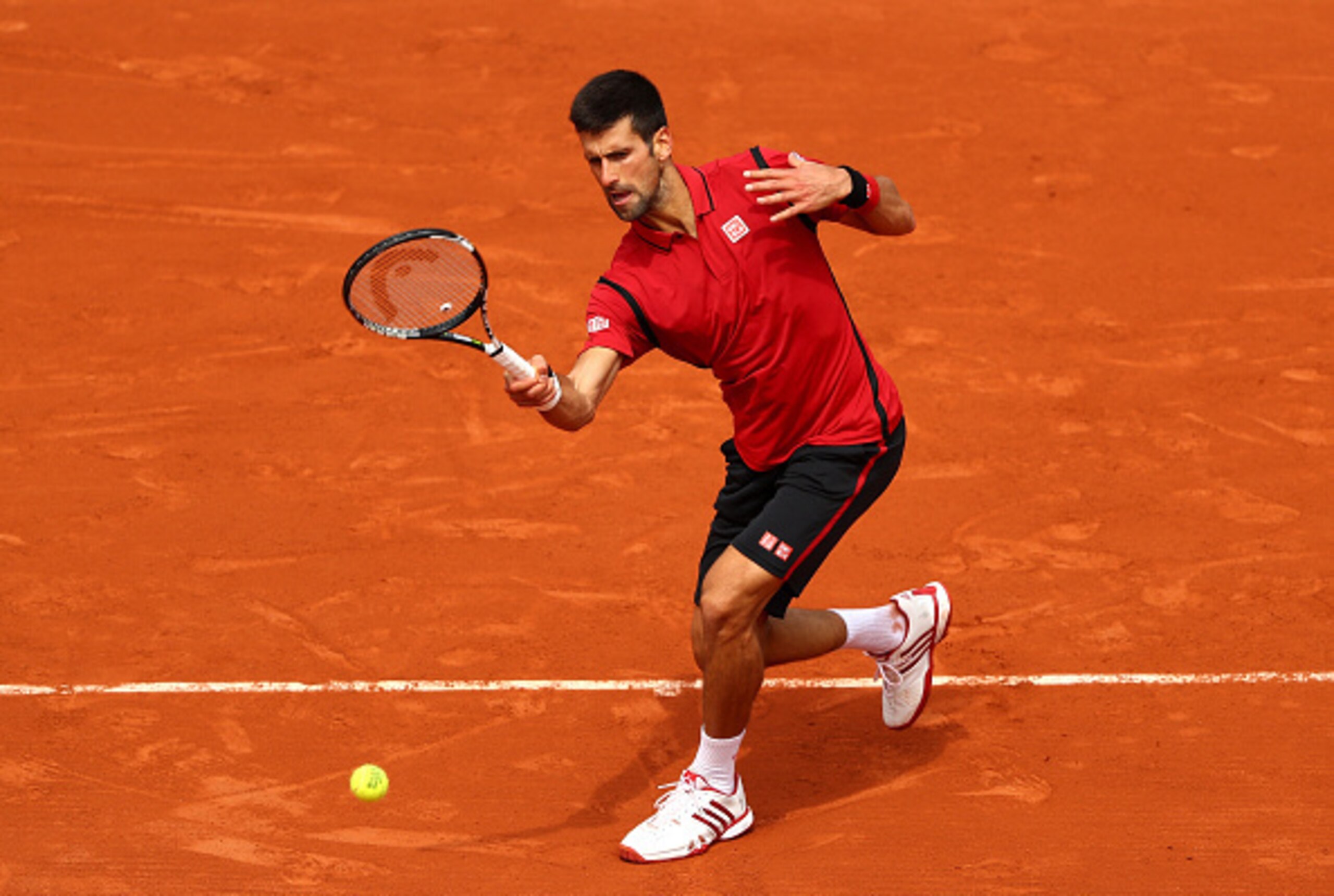Novak Djokovic makes a play on the ball at the 2016 French Open.