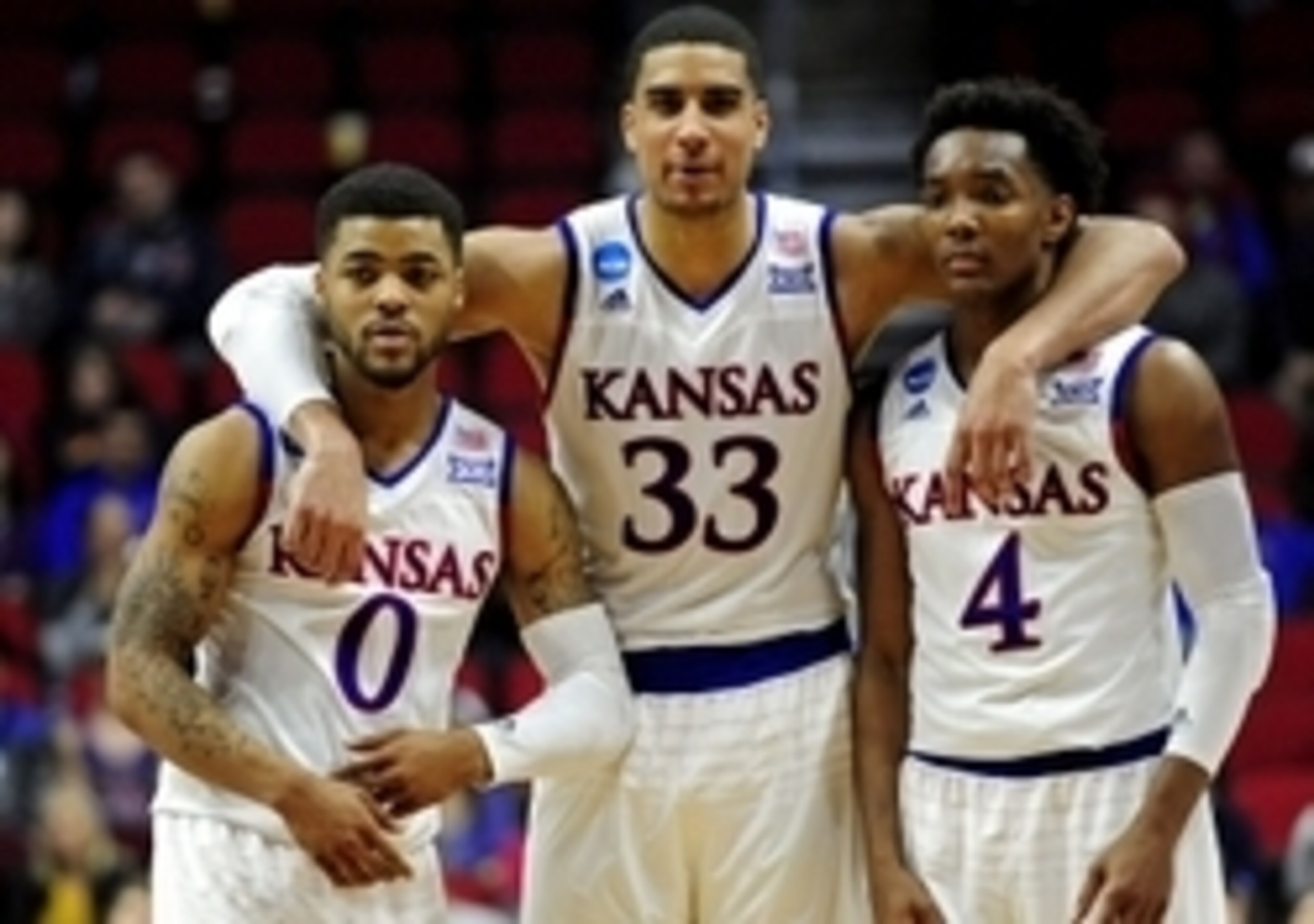 Frank Mason (0), Landen Lucas (33) and Devonte' Graham (4)