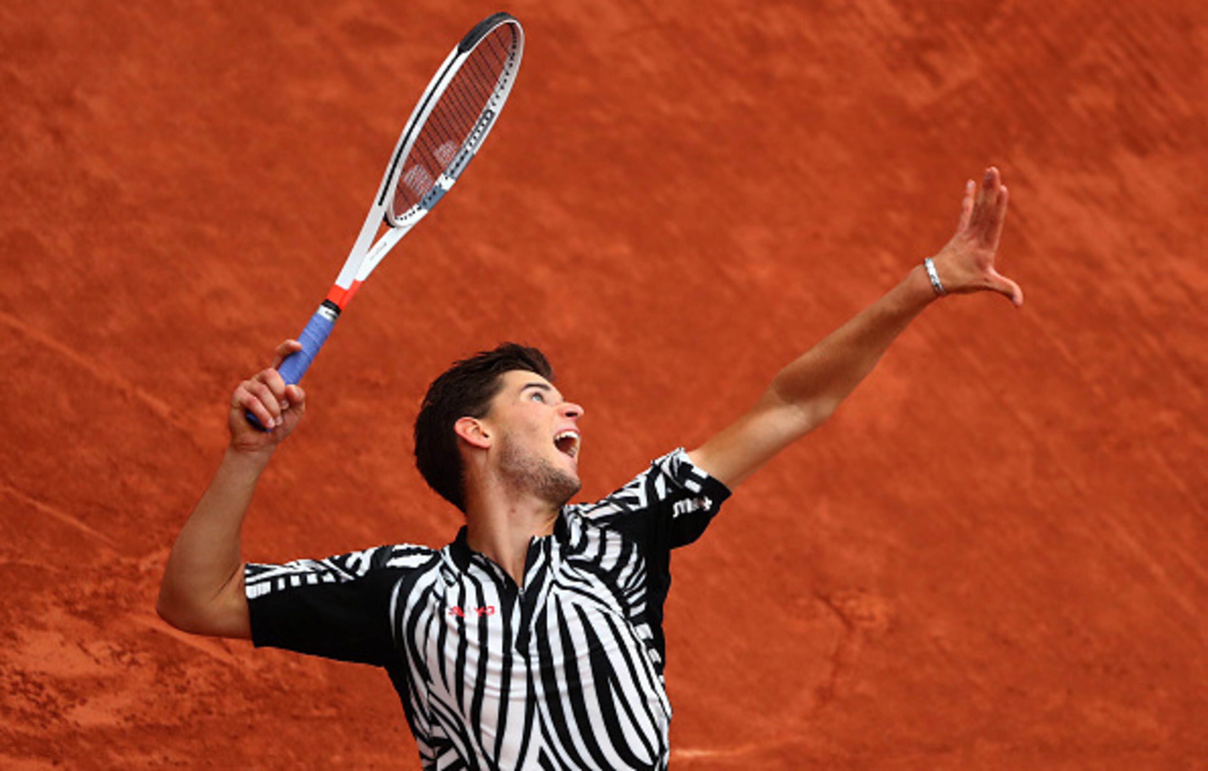 Dominic Thiem serves during his quarterfinals match at the 2016 French Open.