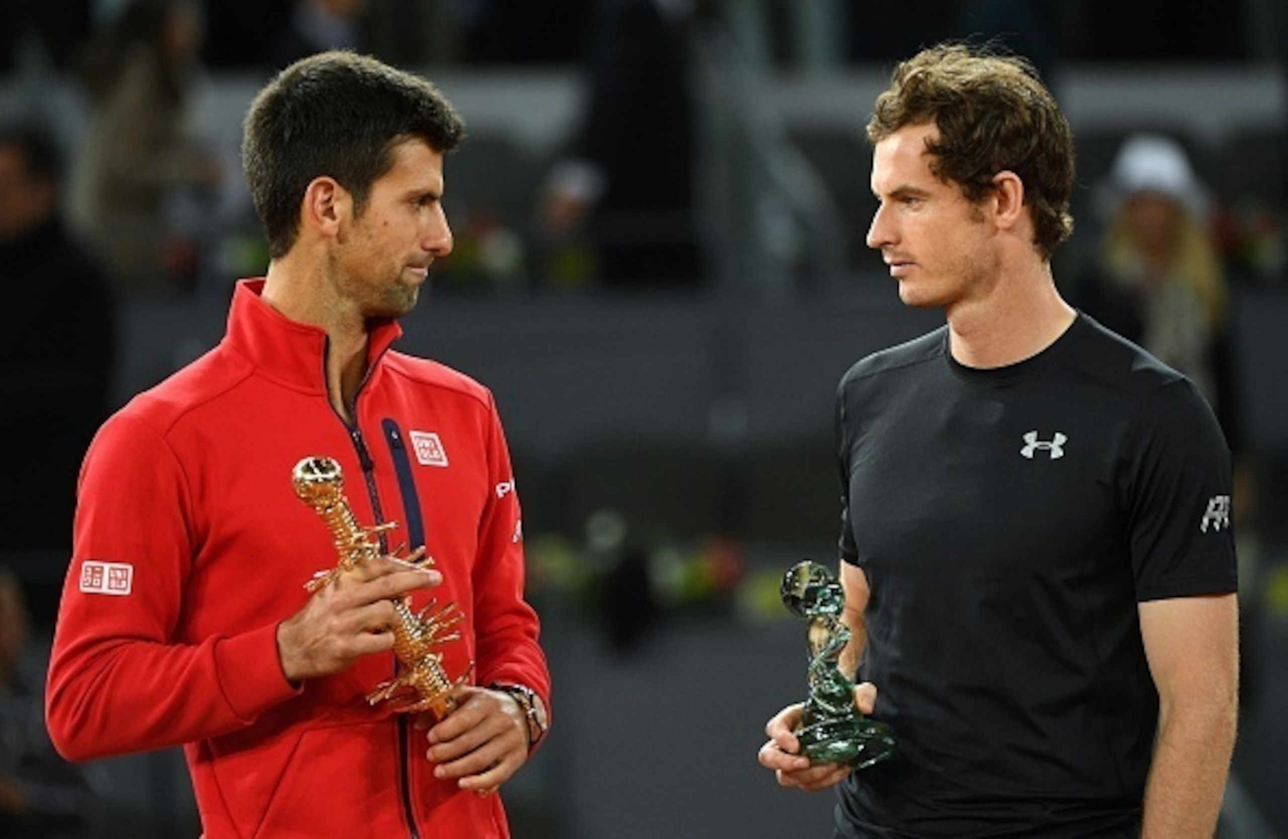 Novak Djokovic and Andy Murray chat during the trophy ceremony at the 2016 Madrid Open.