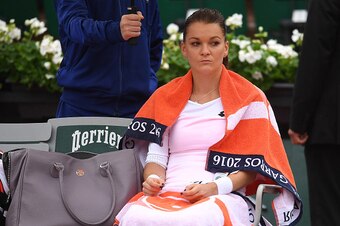 Agnieszka Radwanska sits during a change over at the 2016 French Open.