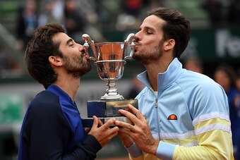 Marc Lopez and Feliciano Lopez celebrate winning the doubles title at the 2016 French Open.