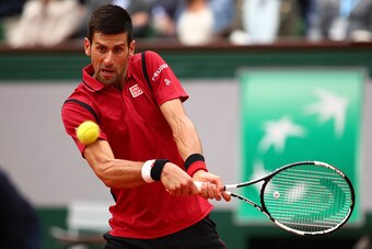 Novak Djokovic hits a backhand during the finals of the 2016 French Open.