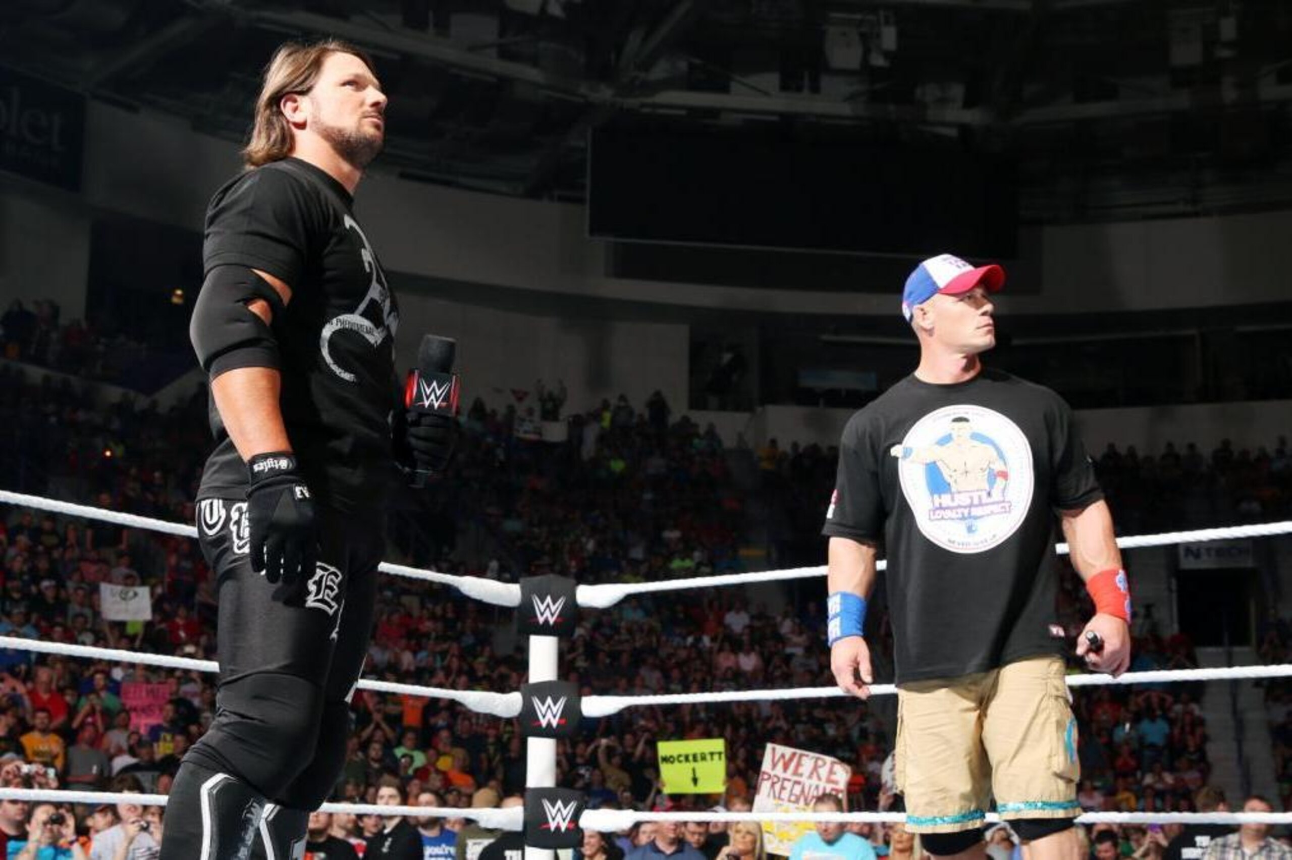 John Cena and AJ Styles in the same ring for the first time ever.