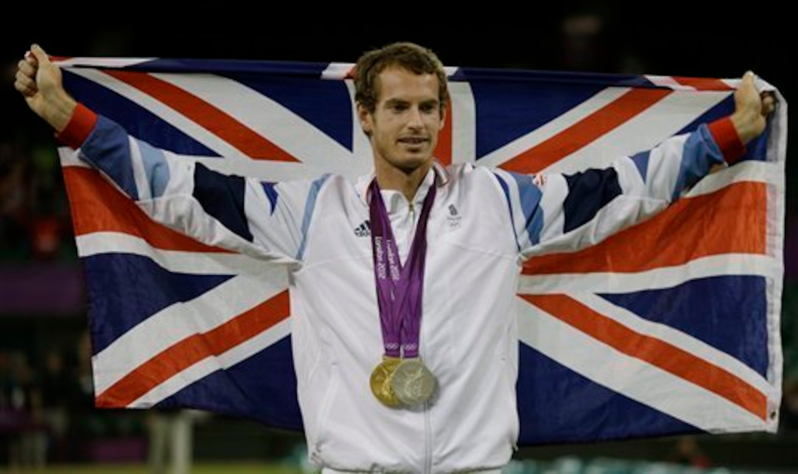 Andy Murray carries the Union Jack while celebrating another medal win at the 2012 Olympics in London.