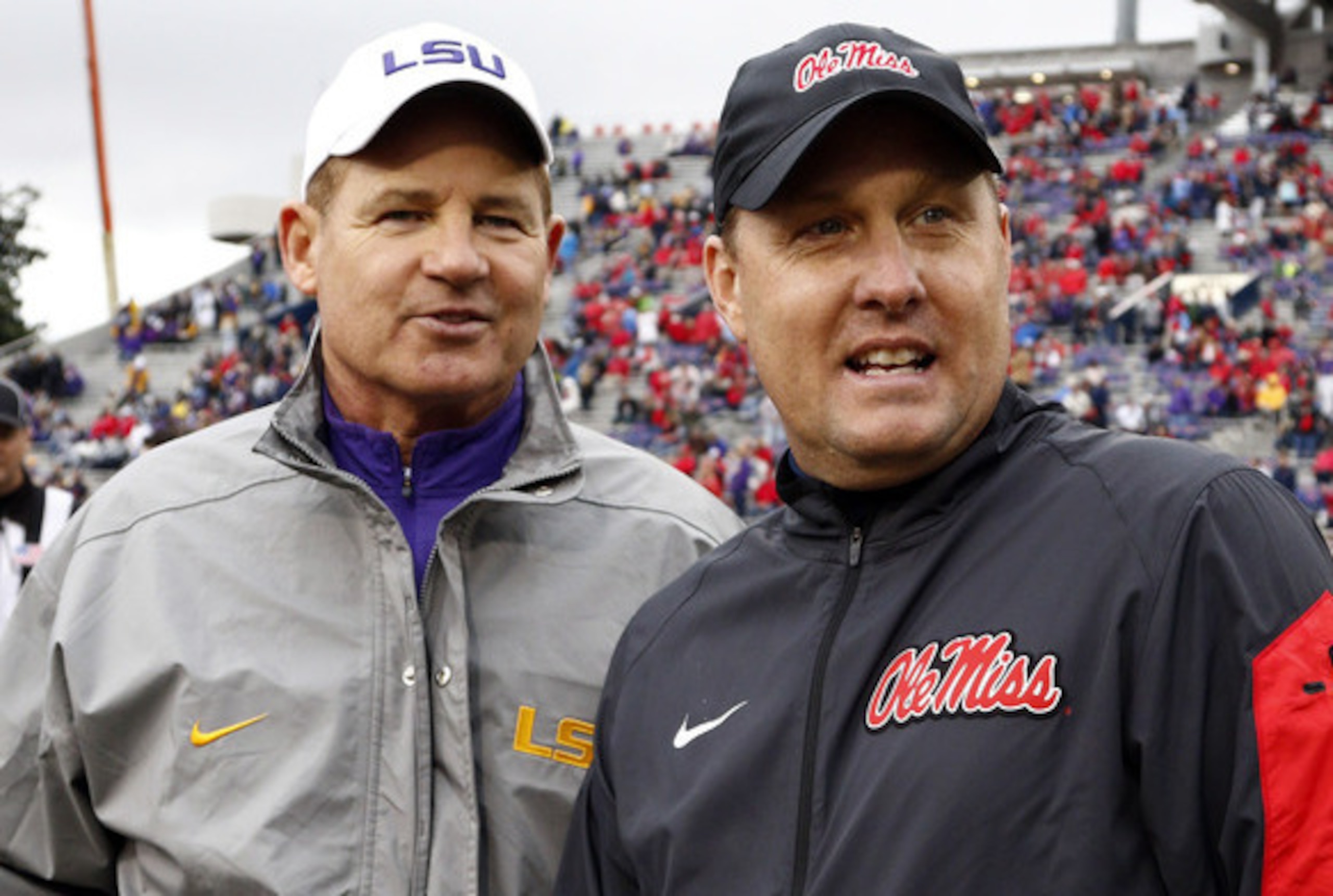 LSU head coach Les Miles (left) and Ole Miss head coach Hugh Freeze.