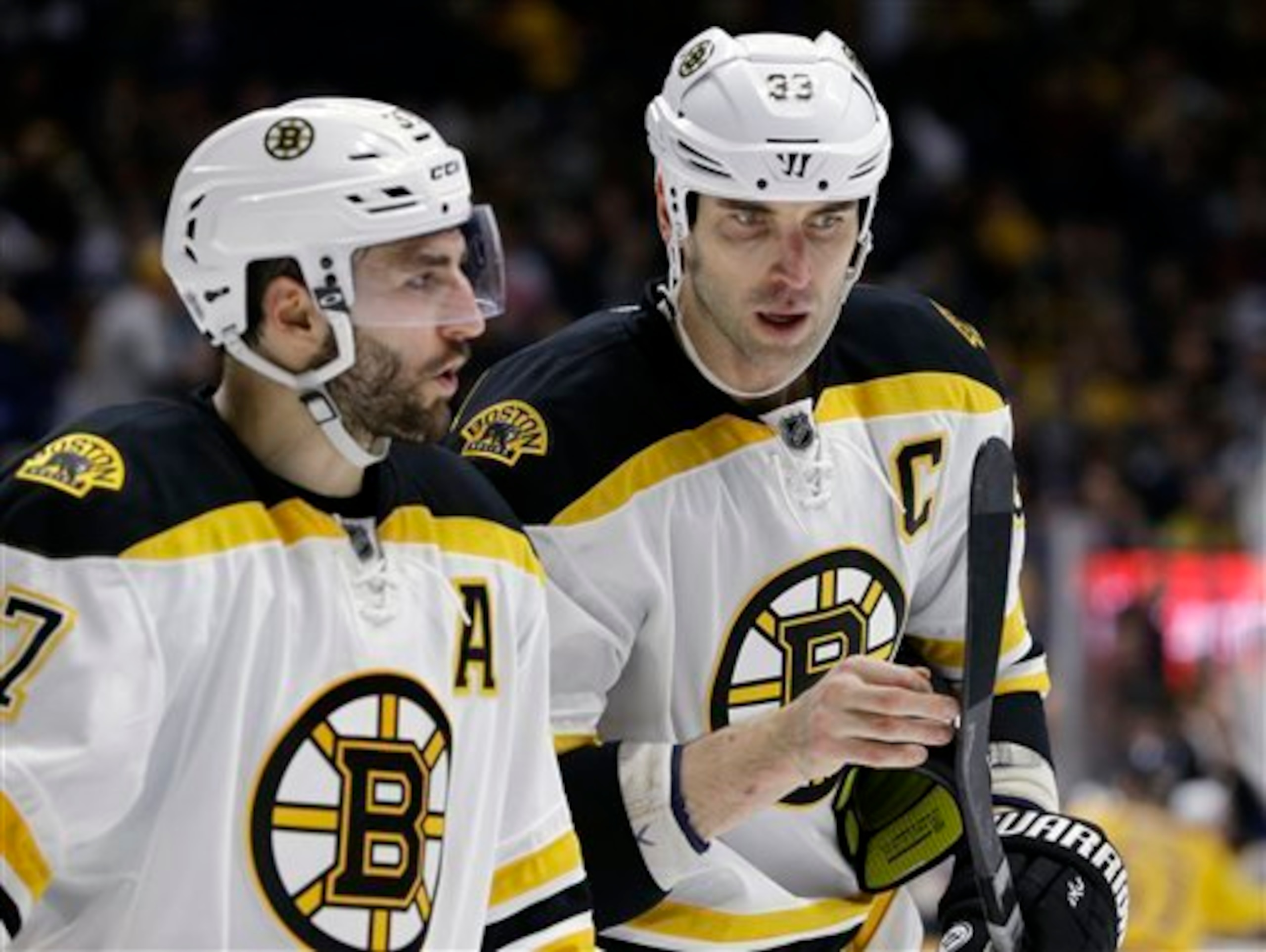 Patrice Bergeron (left) and Bruins captain Zdeno Chara.
