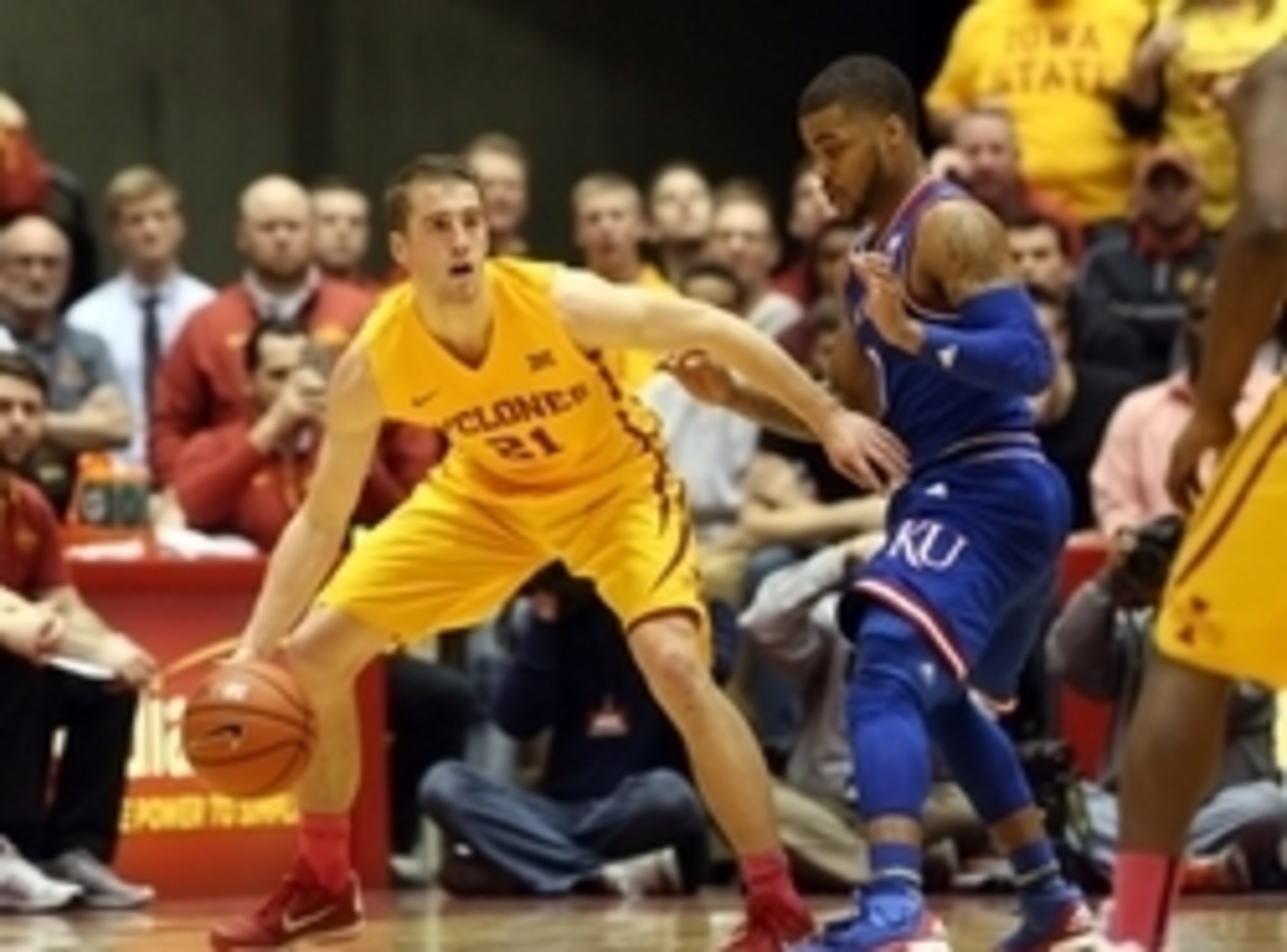 Jan 25, 2016; Ames, IA, USA; Iowa State Cyclones guard Matt Thomas (21) controls the basketball while defended byKansas Jayhawks guard Frank Mason III (0) at James H. Hilton Coliseum. The Cyclones beat the Jayhawks 85-72.  Mandatory Credit: Reese Strickla