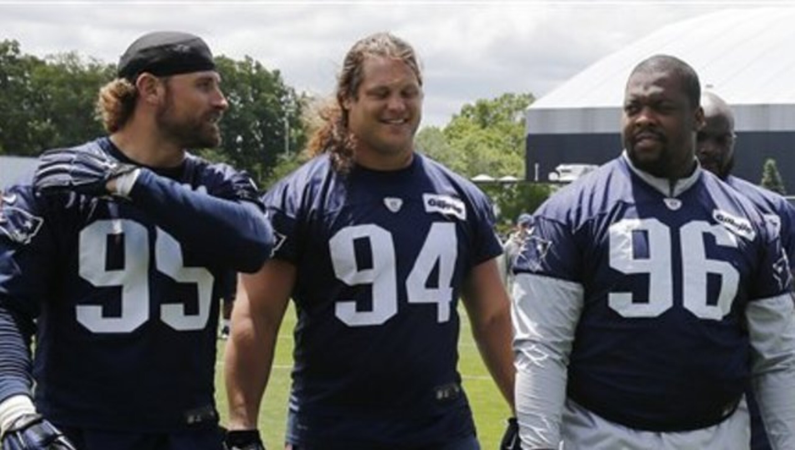 New Patriots' defensive linemen Chris Long (95), Markus Kuhn (94) and Terrance Knighton (96).