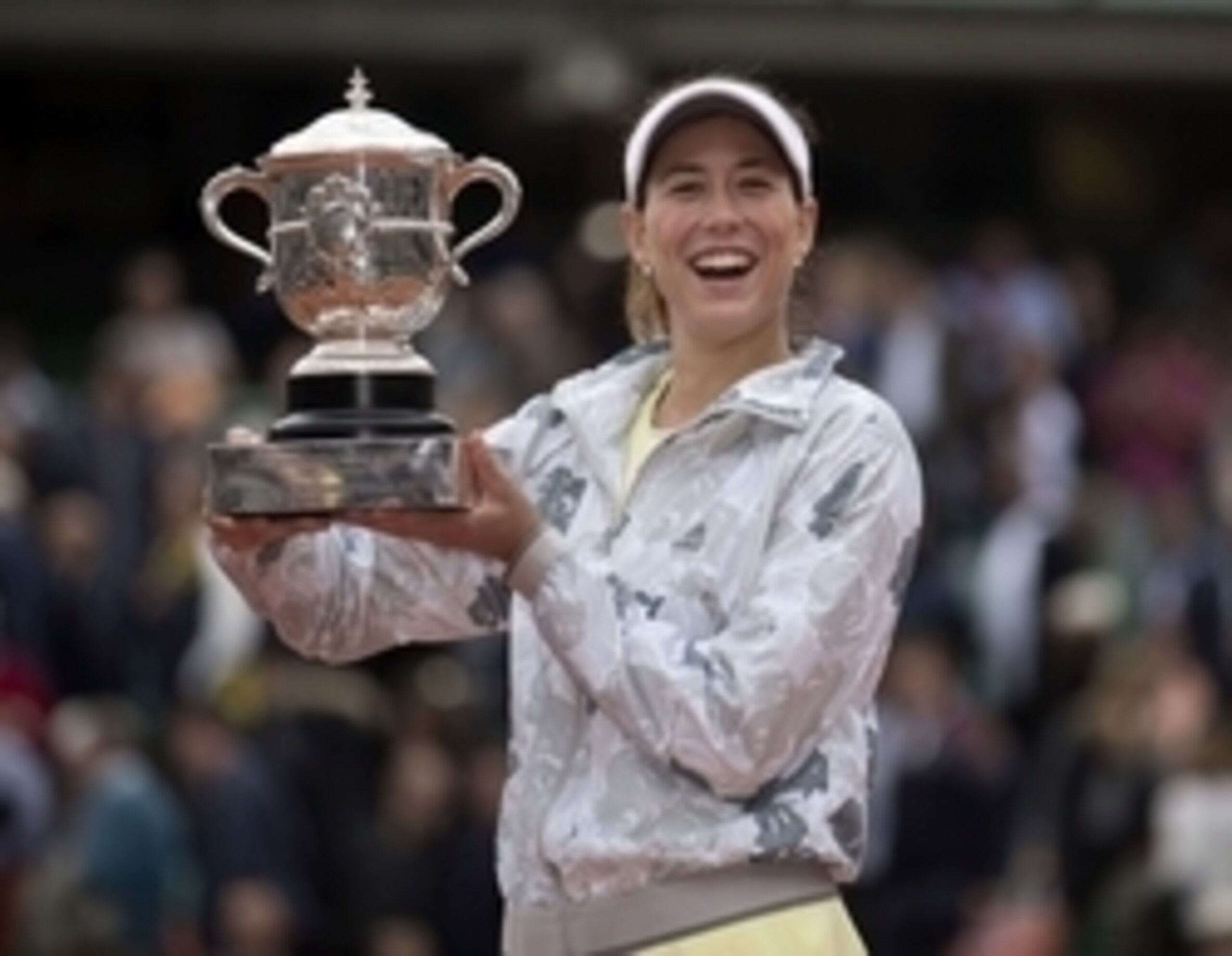 Muguruza is all smiles after a dominant victory in the French Open final.