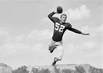 Harry Gilmer's trademark leaping passes keyed the Crimson Tide offense in the 1940s.