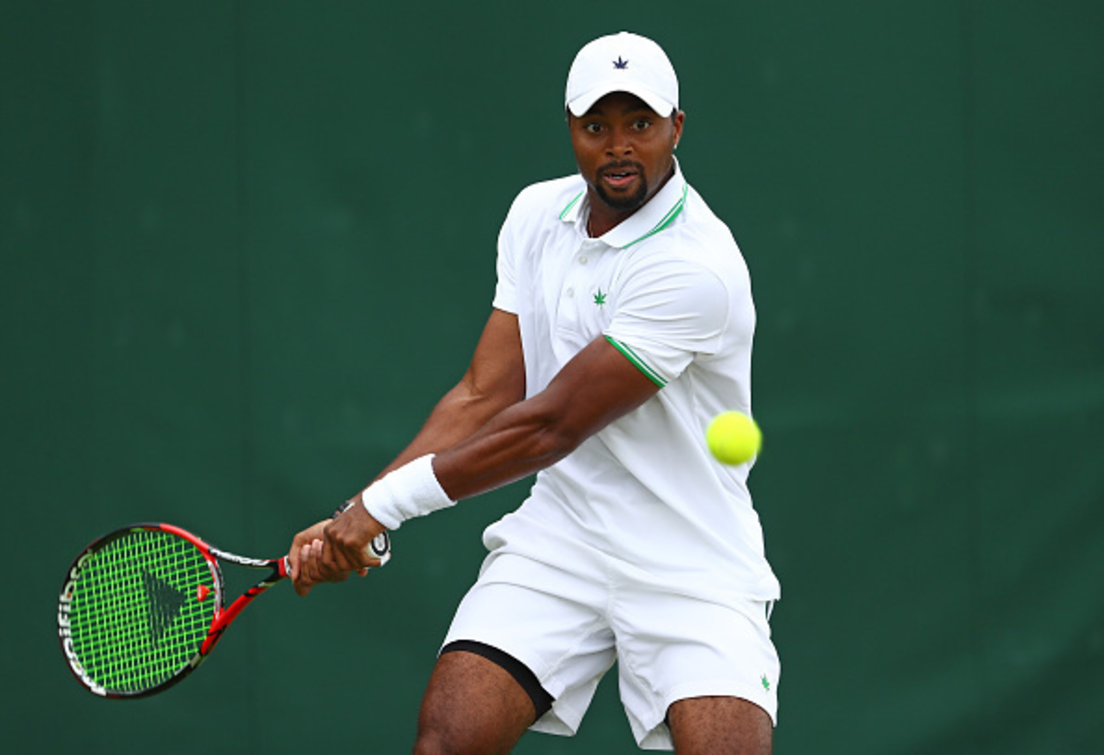 Donald Young hits a backhand during his first-round match at Wimbledon 2016.