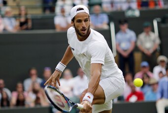 Feliciano Lopez volleys during a match at Wimbledon 2016.