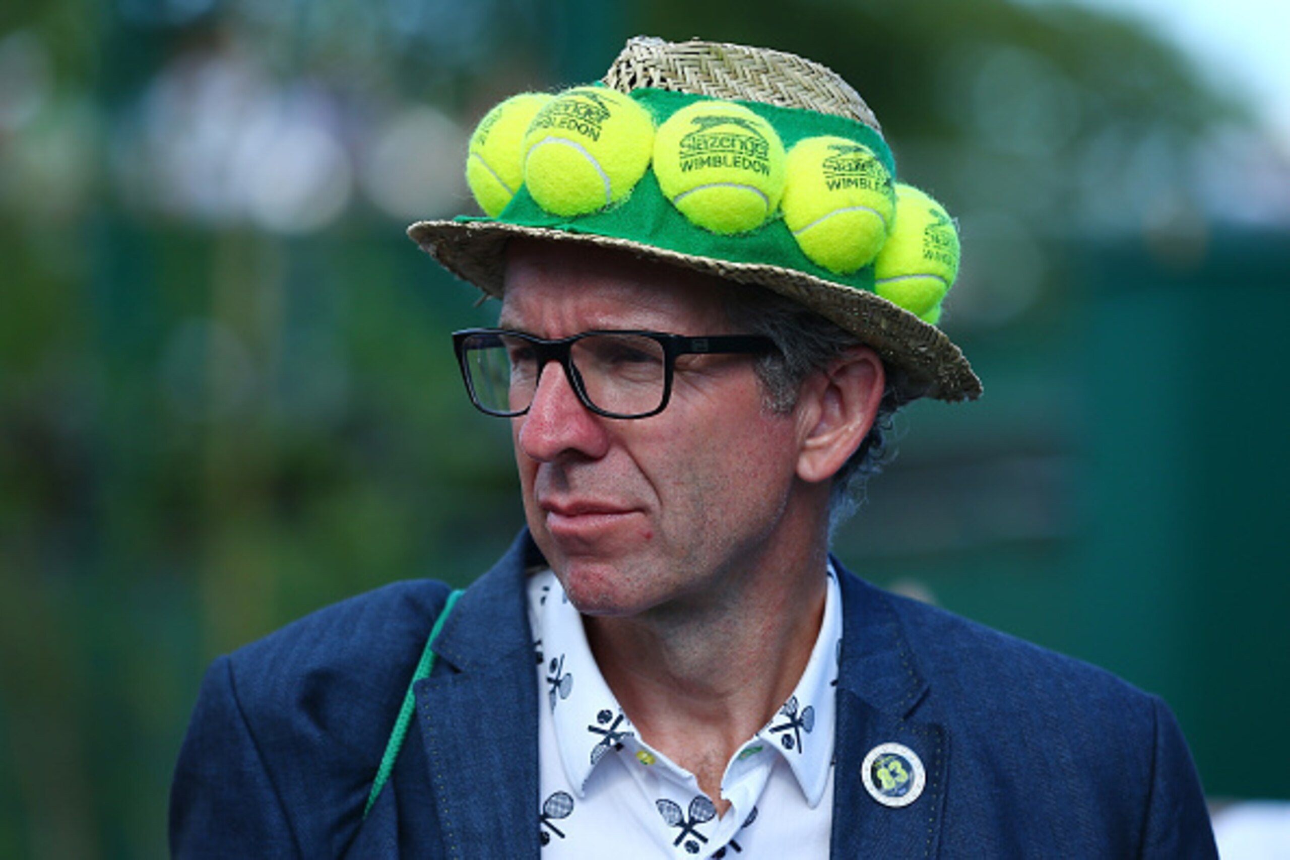 Spectator at Wimbledon wears a unique tennis balls hat. Spectator at Wimbledon wears a unique tennis balls hat.