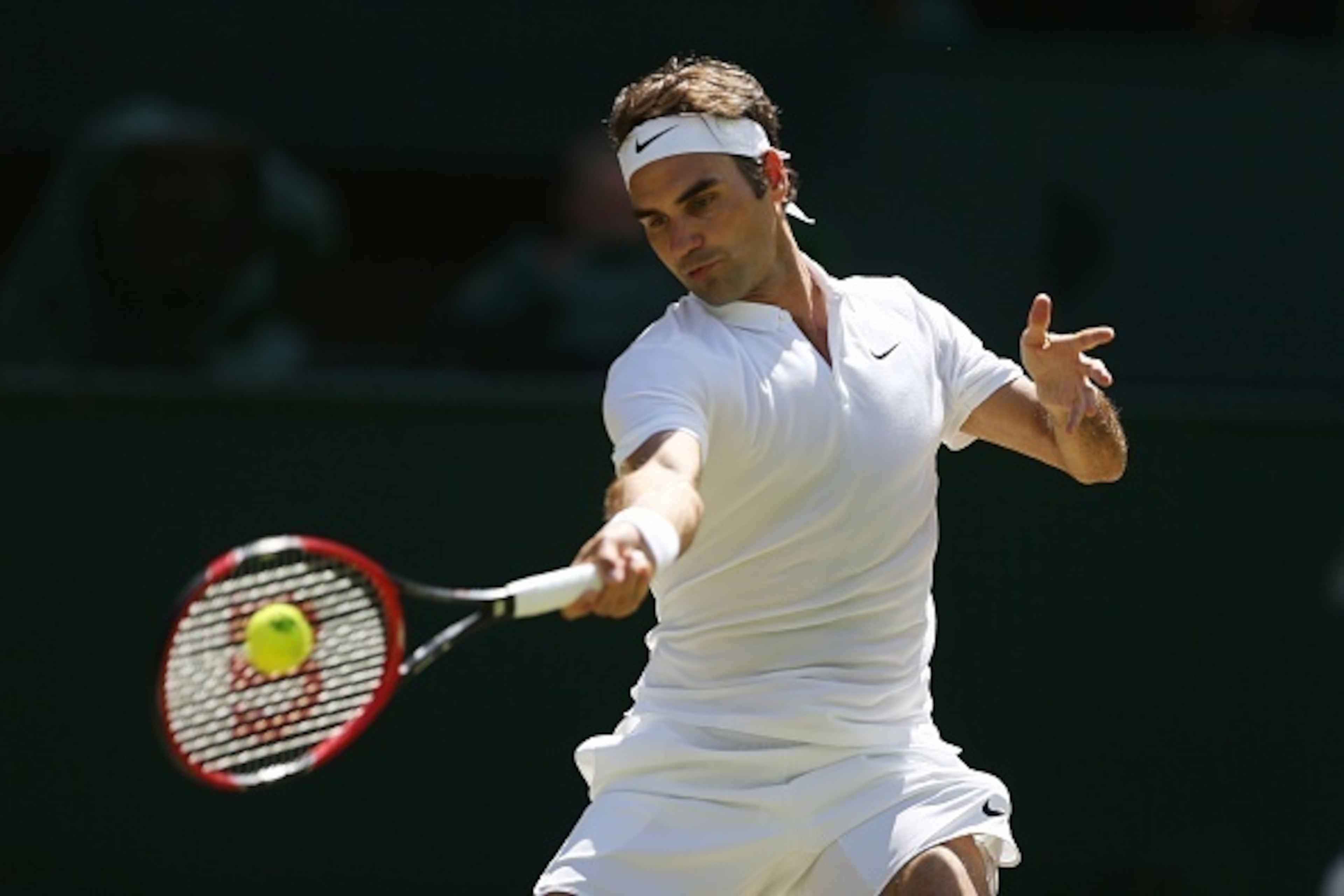 Federer strikes a forehand against Cilic during his quarterfinal win.