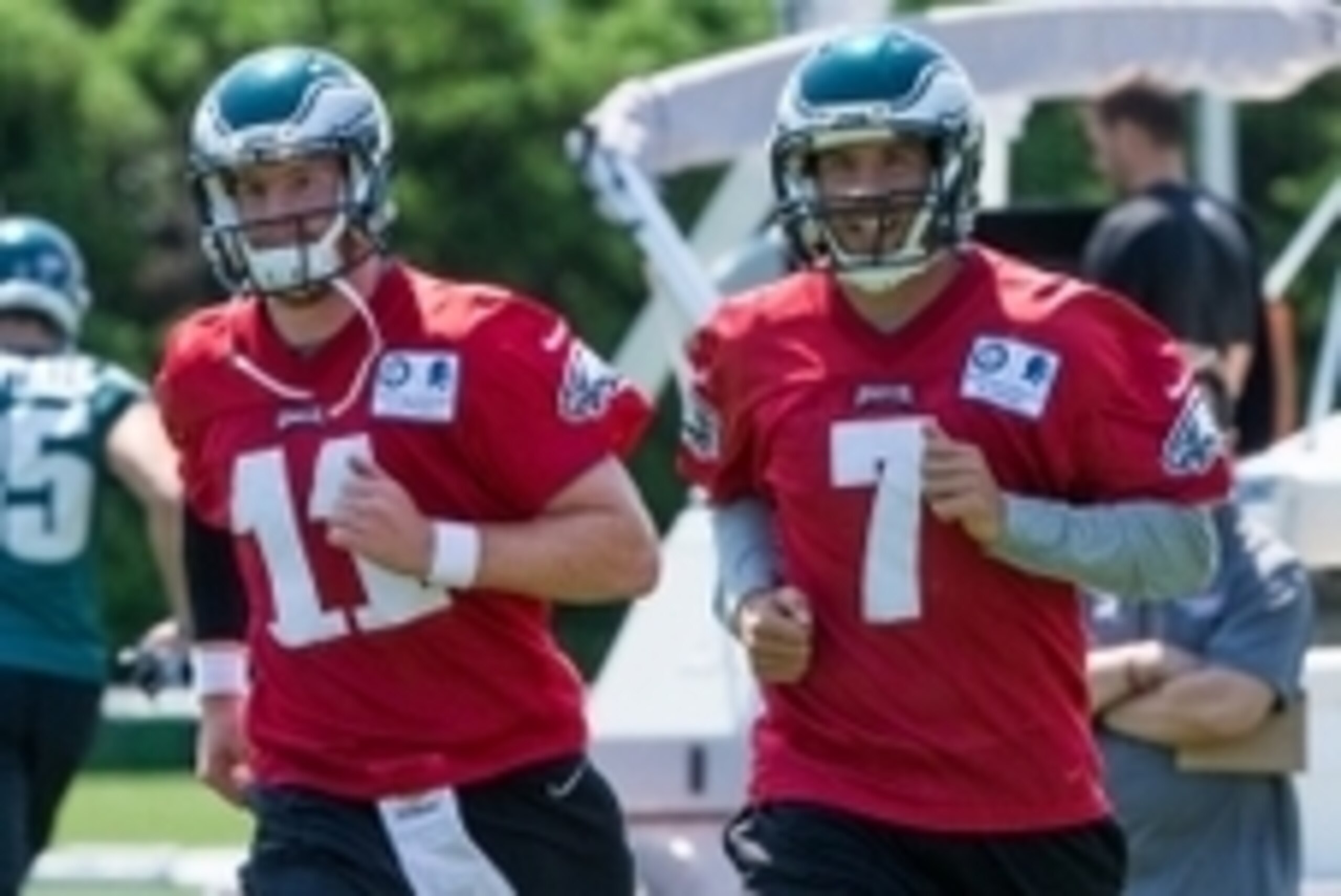 Eagles QBs Carson Wentz (left) and Sam Bradford
