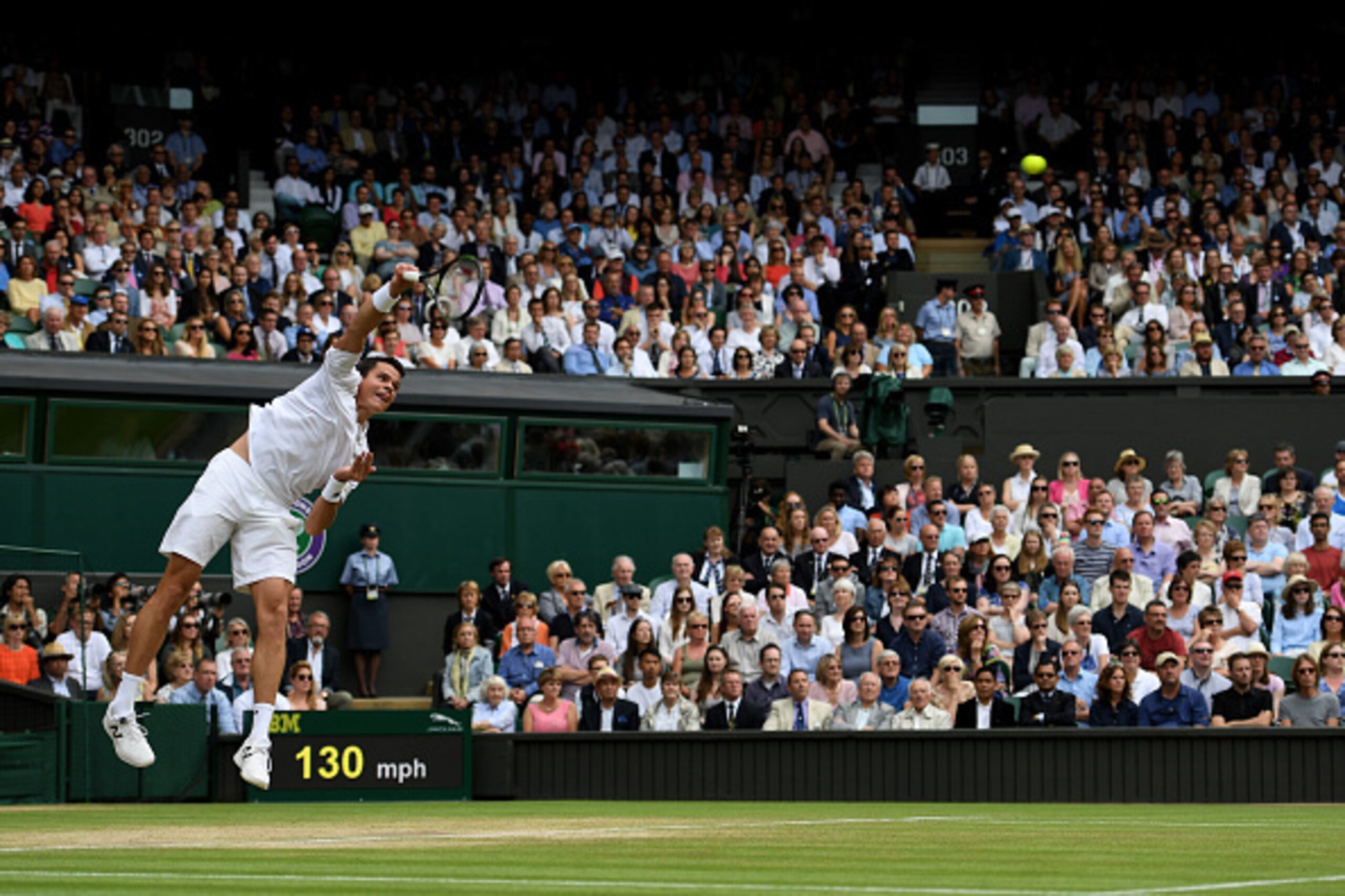 Milos Raonic serves during a match at Wimbledon 2016.