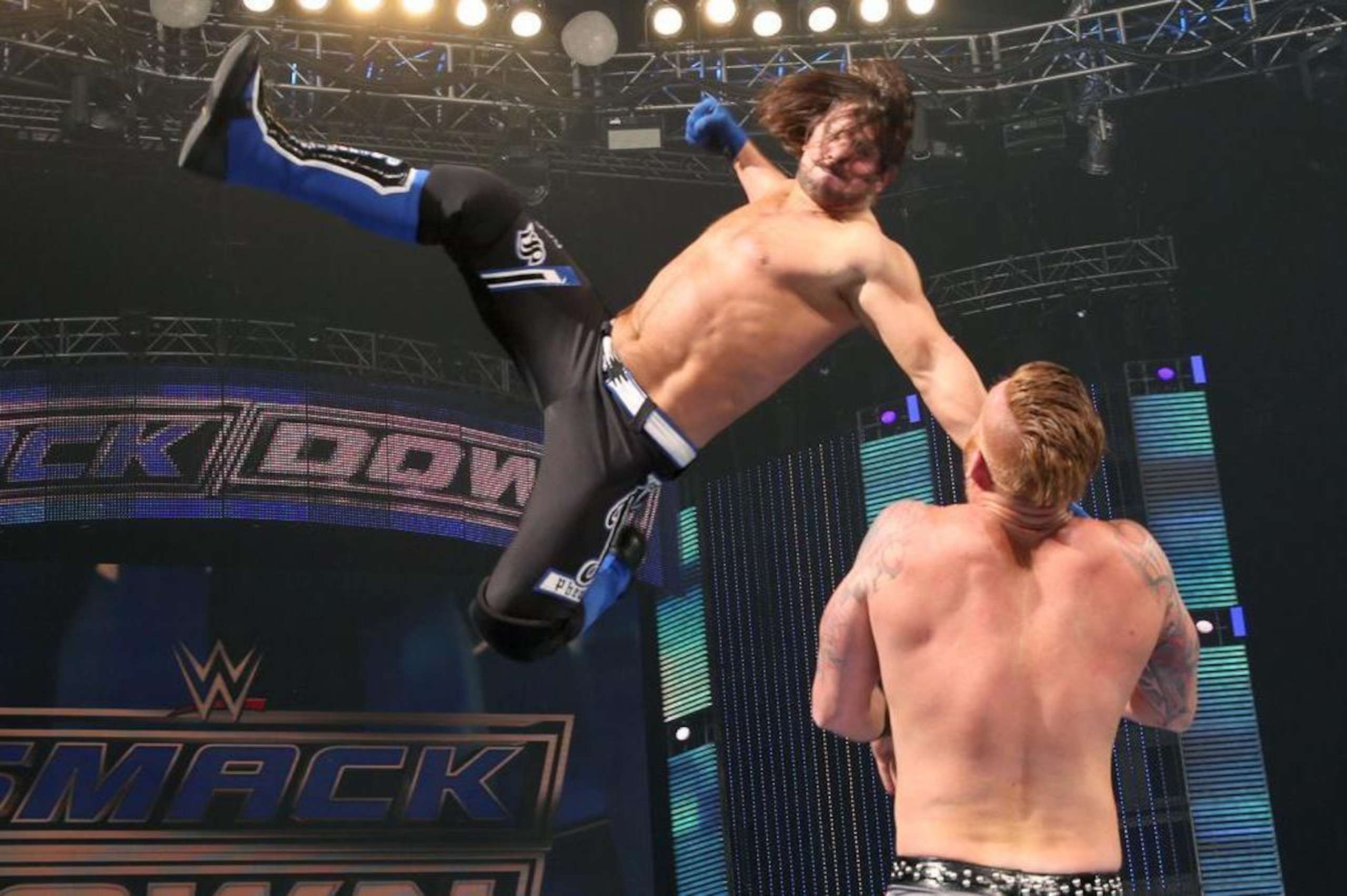 AJ Styles hitting Heath Slater with the Phenomenal Forearm. AJ Styles hitting Heath Slater with the Phenomenal Forearm.