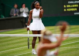 Serena Williams celebrates hitting a winner as Angelique Kerber applauds.