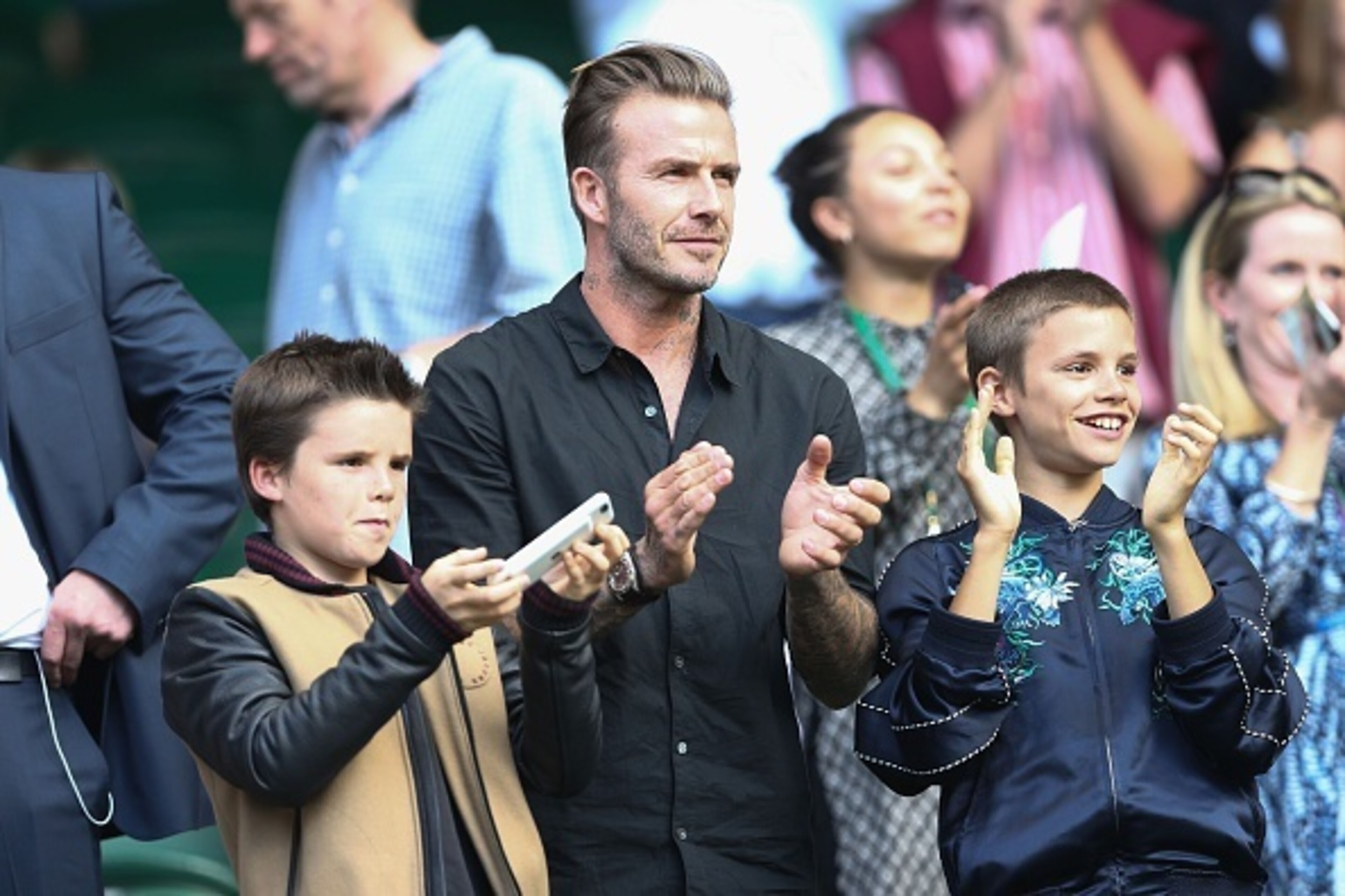 David Beckham with sons Romeo and Cruz during a match at Wimbledon 2016.