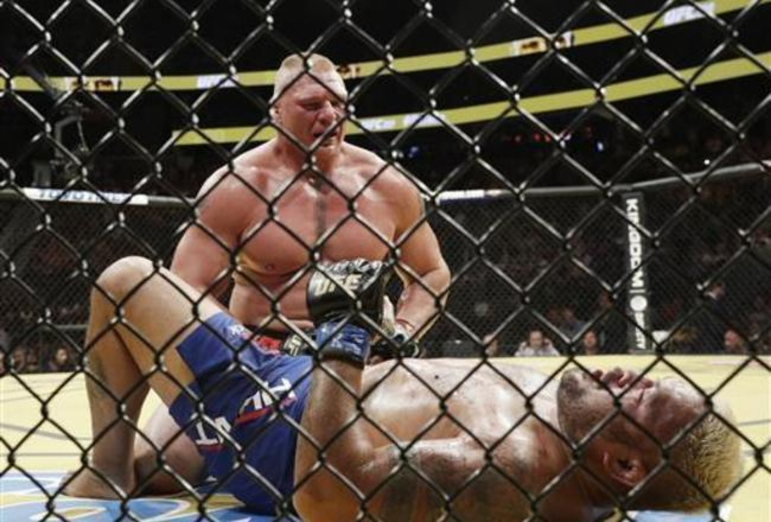 Brock Lesnar (top) and Mark Hunt (lying down) Brock Lesnar (top) and Mark Hunt (lying down)