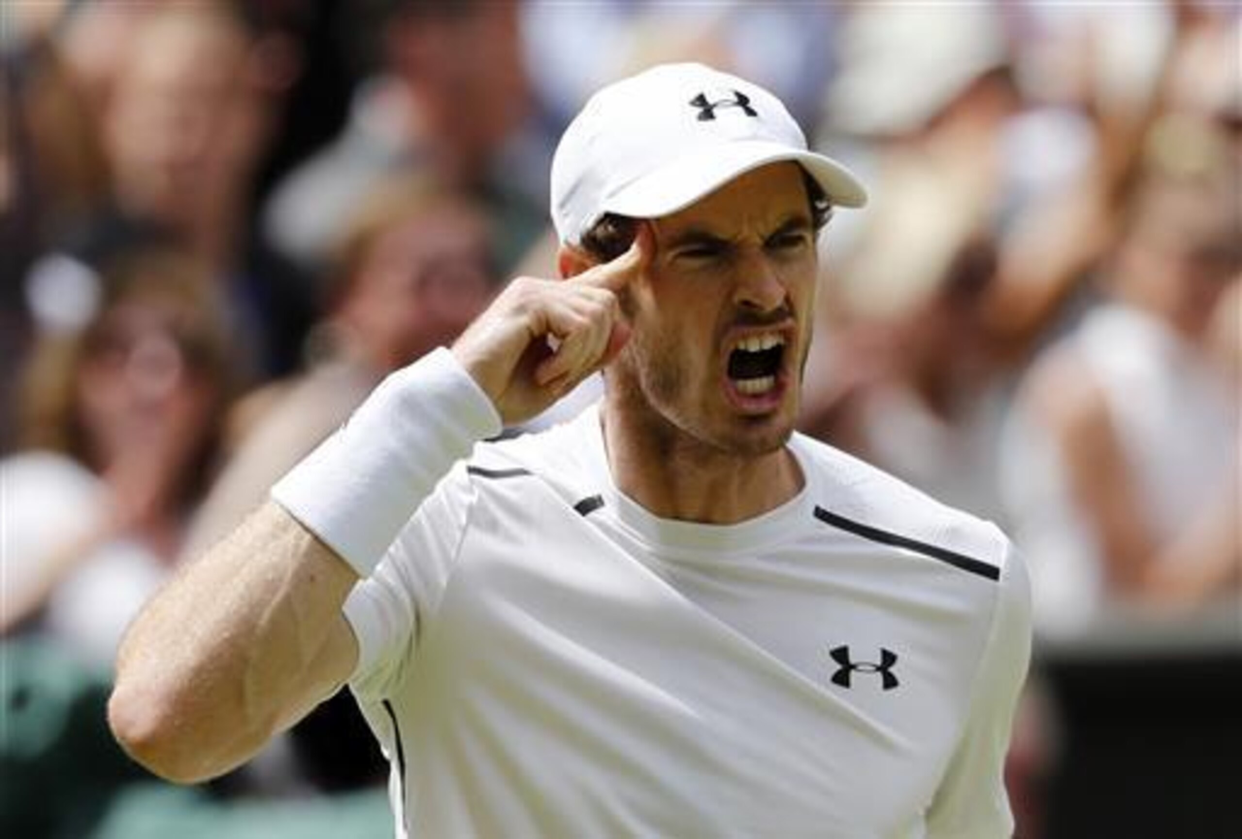 Andy Murray reminds himself to use his head during a match at Wimbledon 2016. Andy Murray reminds himself to use his head during a match at Wimbledon 2016.