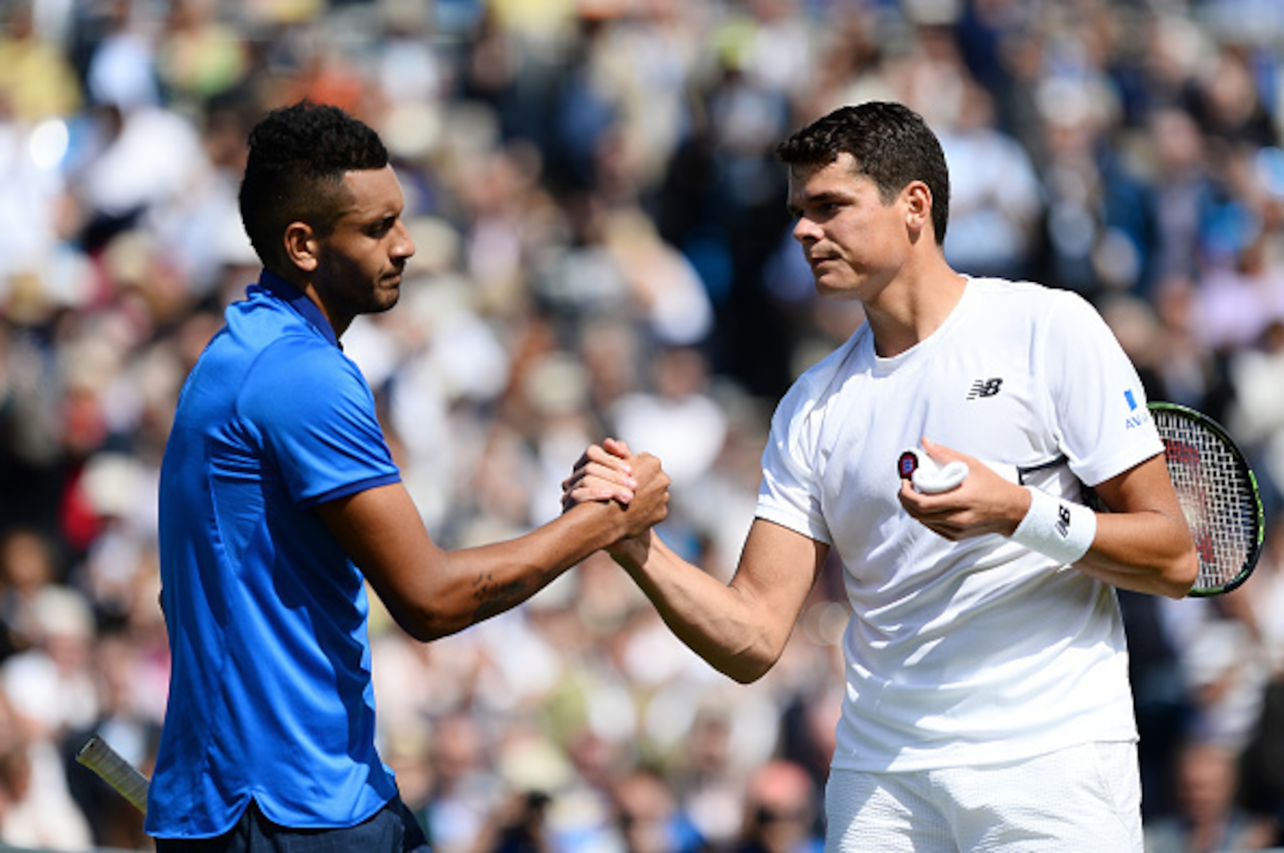 Nick Kyrgios and Milos Raonic shake hands after their match at the Aegon Championships in London.
