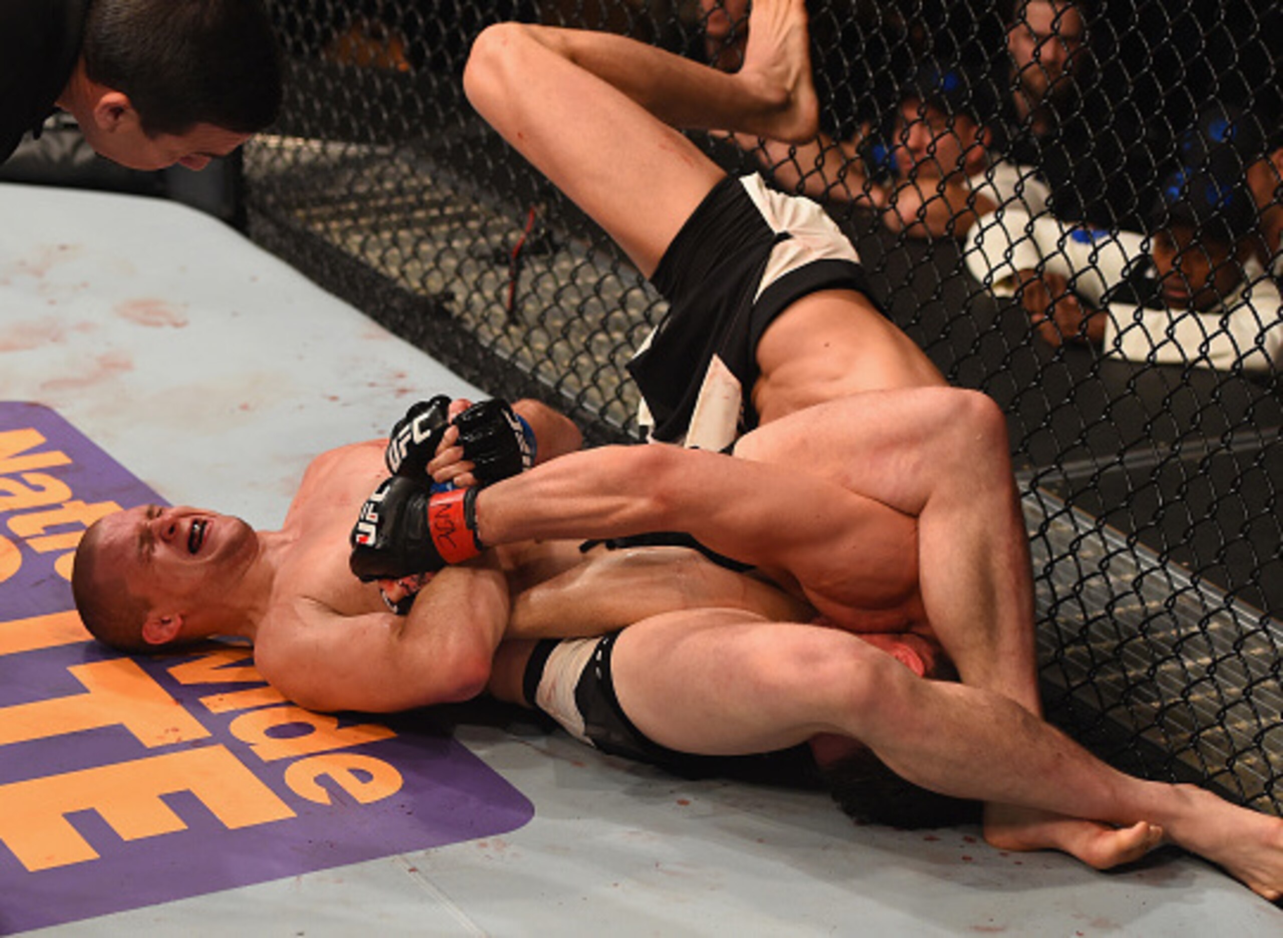 Kyle Noke goes for an armbar on Alex Morono.