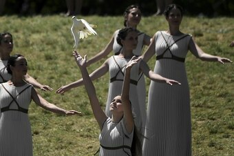 Opening ceremony: people dressed as doves. Torch relay: real doves.