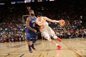 7'1" Zhou Qi goes to work against DeMarcus Cousins.