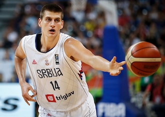 Nikola Jokic reaches for the basketball.