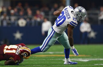 ARLINGTON, TX - JANUARY 03:   Darren McFadden #20 of the Dallas Cowboys runs the ball past Will Blackmon #41 of the Washington Redskins in the fourth quarter at AT&T Stadium on January 3, 2016 in Arlington, Texas.  (Photo by Ronald Martinez/Getty Images)