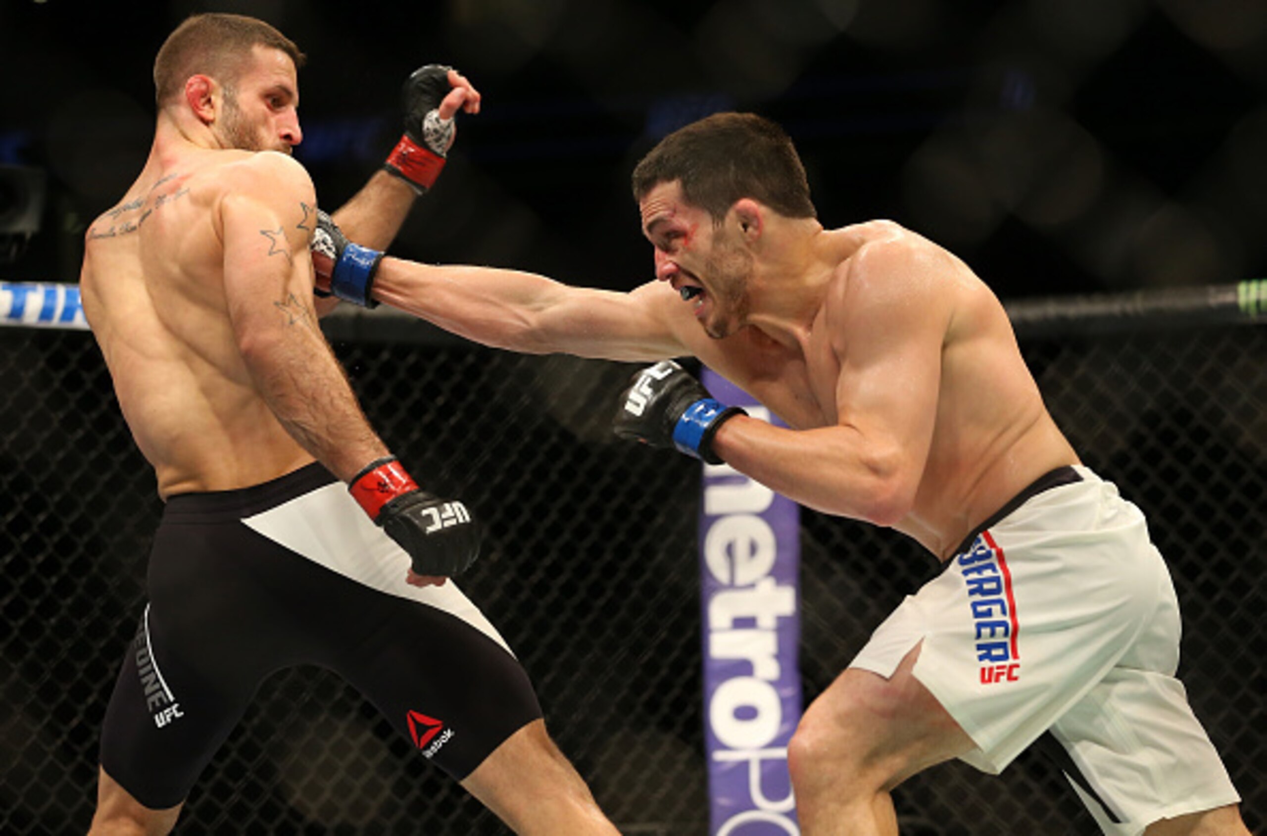 Jake Ellenberger punches Tarec Saffiedine