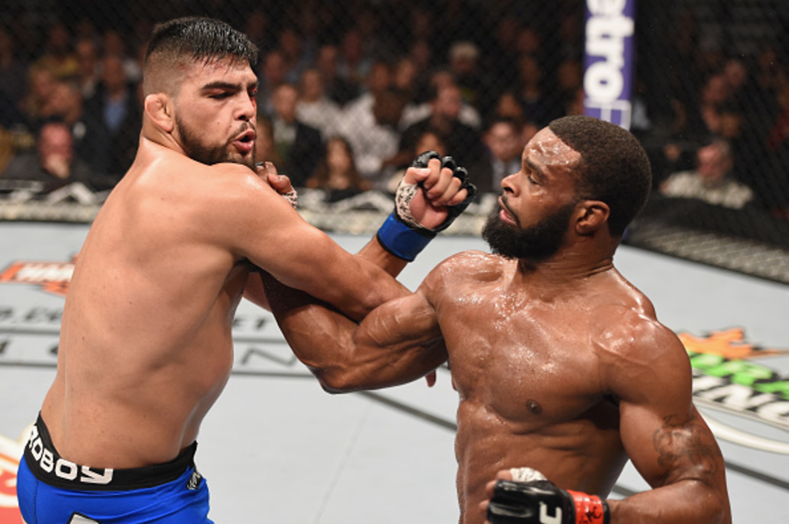Tyron Woodley lands an uppercut on Kelvin Gastelum