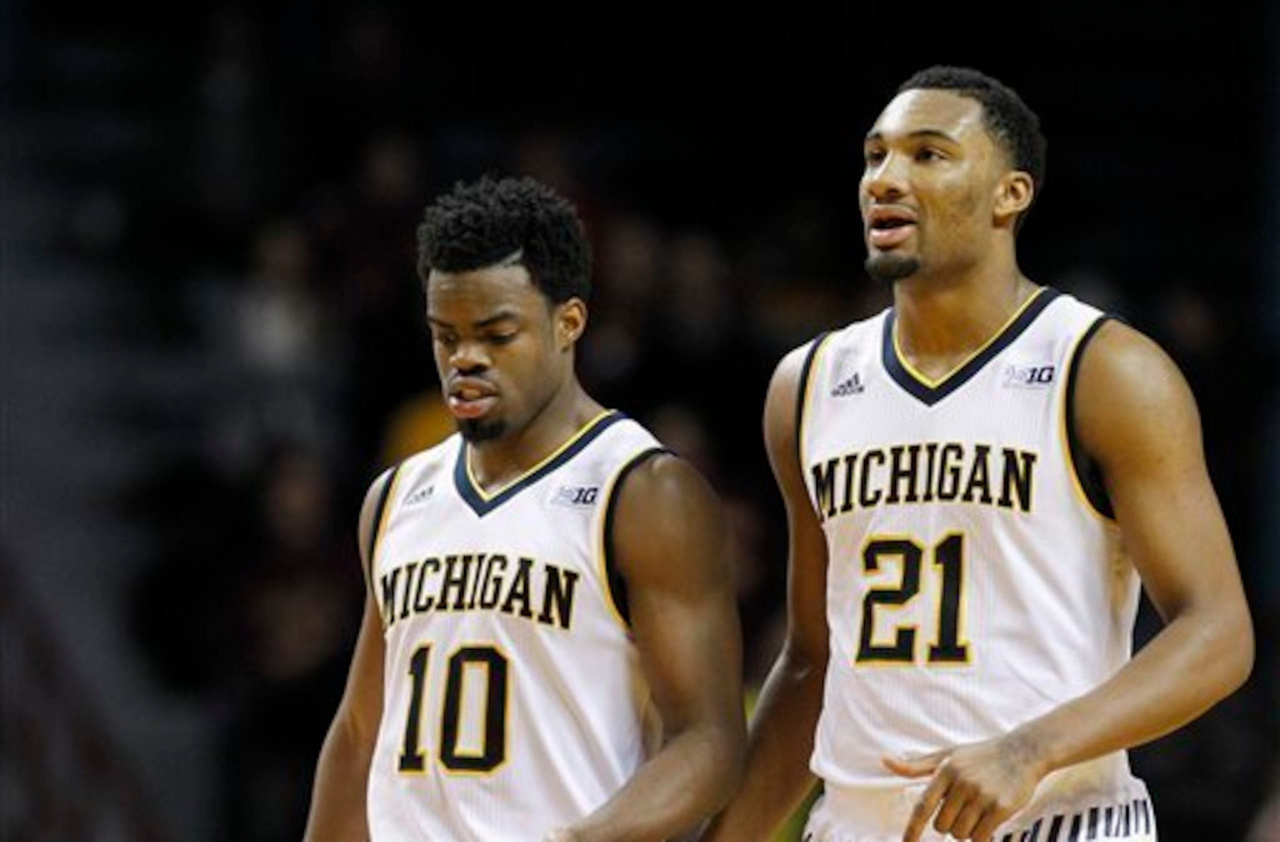 Derrick Walton (10) and Zak Irvin (21)
