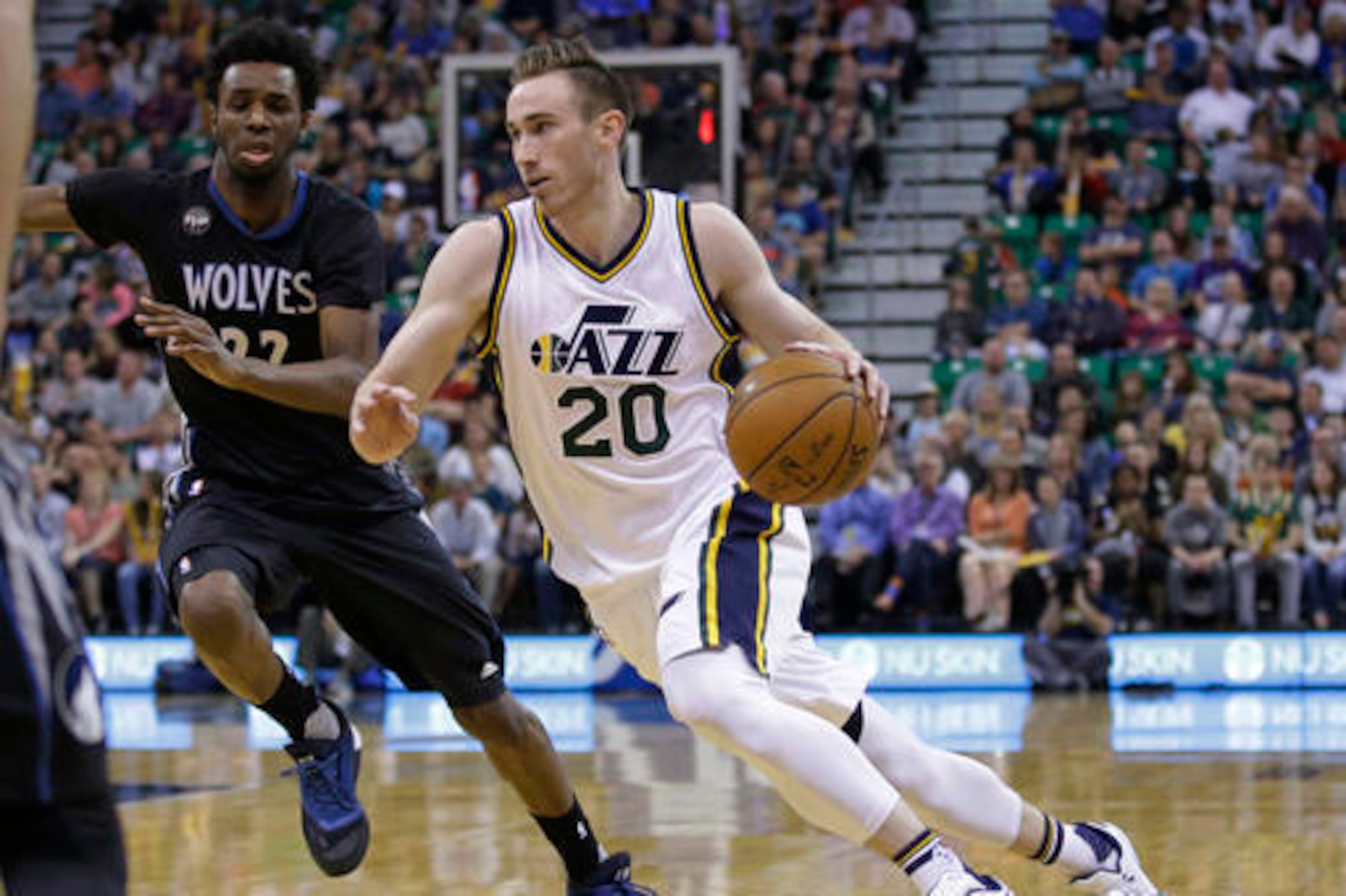 Andrew Wiggins (left) defending Gordon Hayward