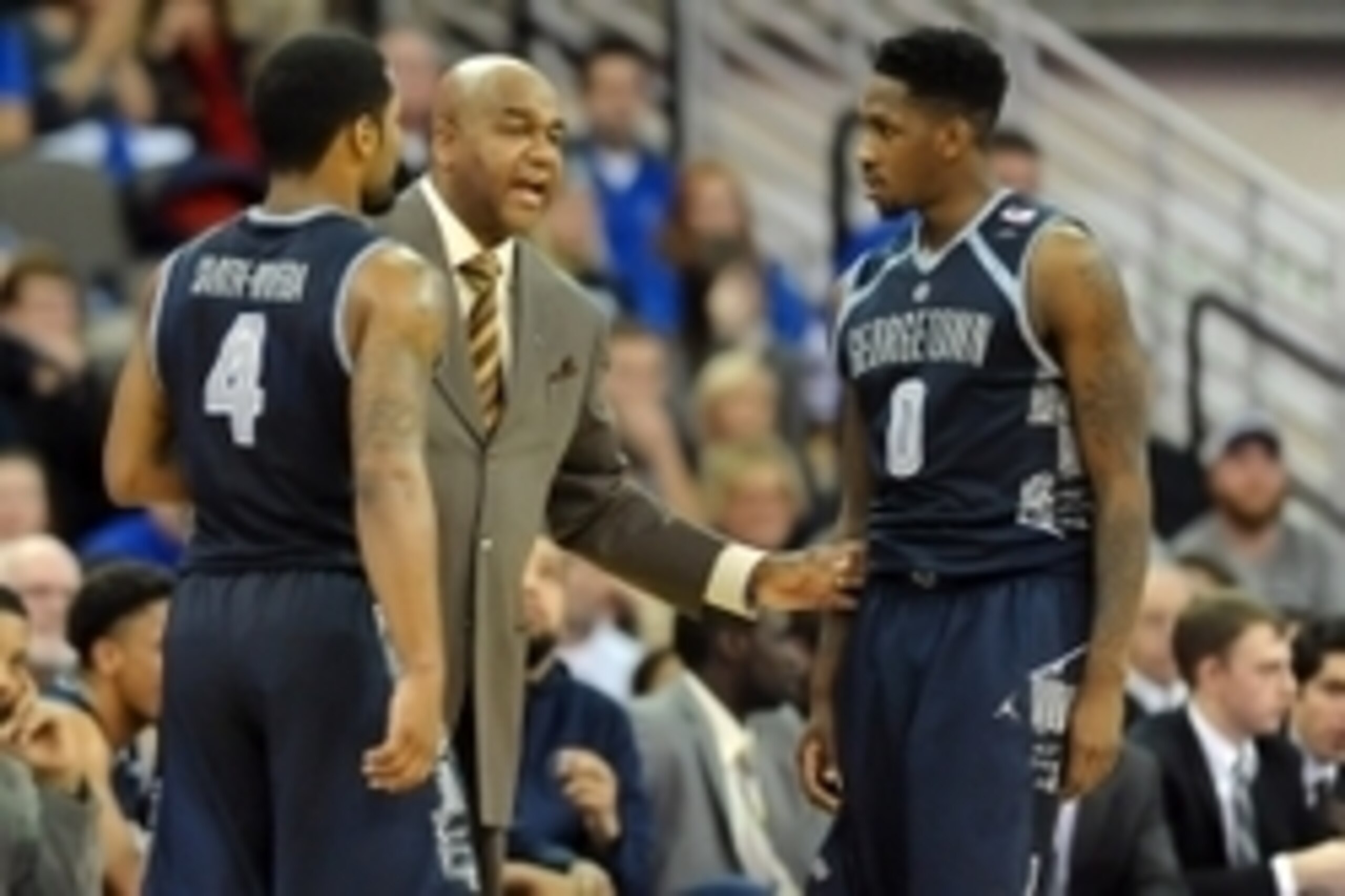 John Thompson III with D'Vauntes Smith-Rivera (4) and L.J. Peak (0)