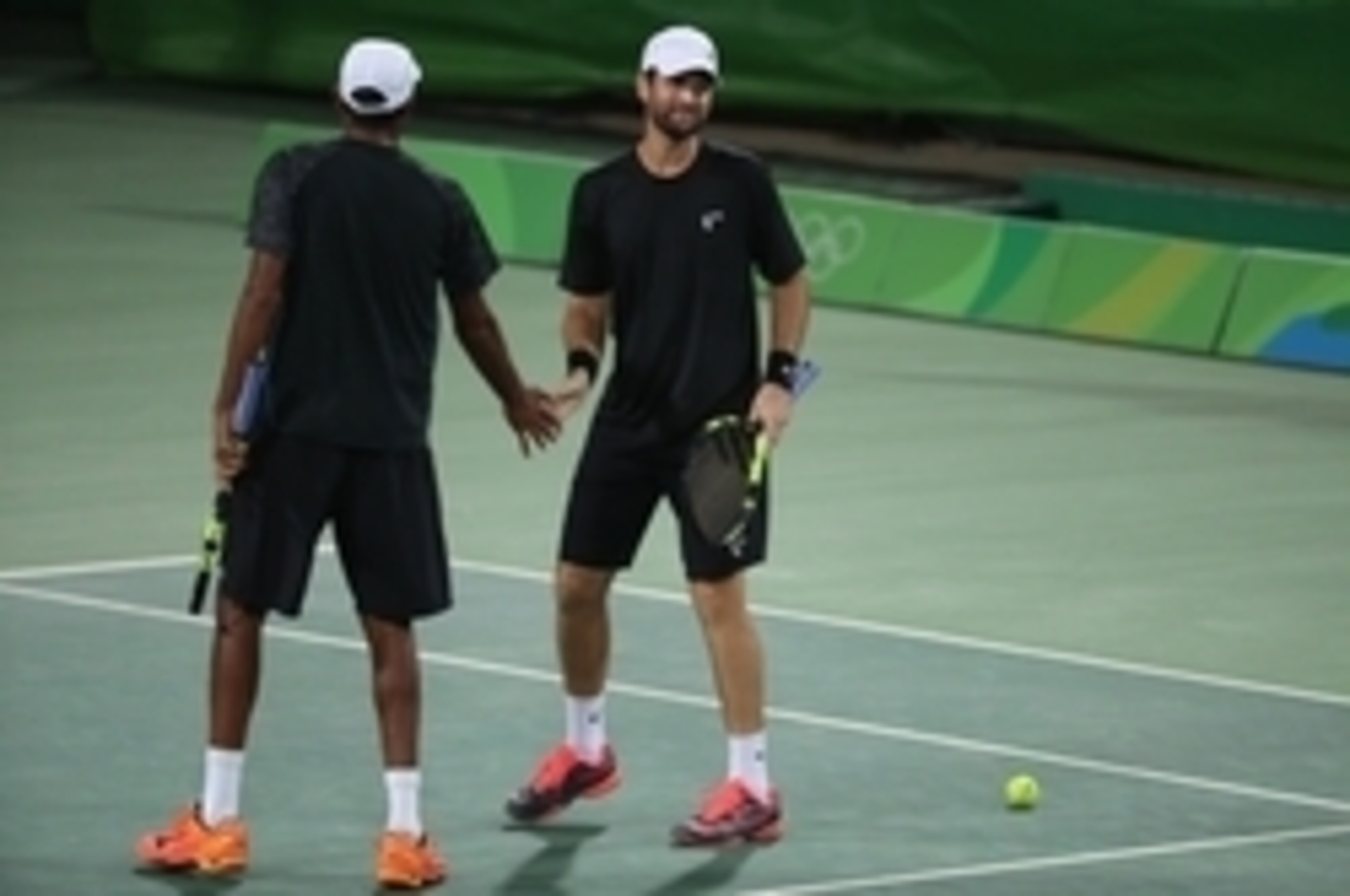 Rajeev Ram and Brian Baker during a first-round doubles match.